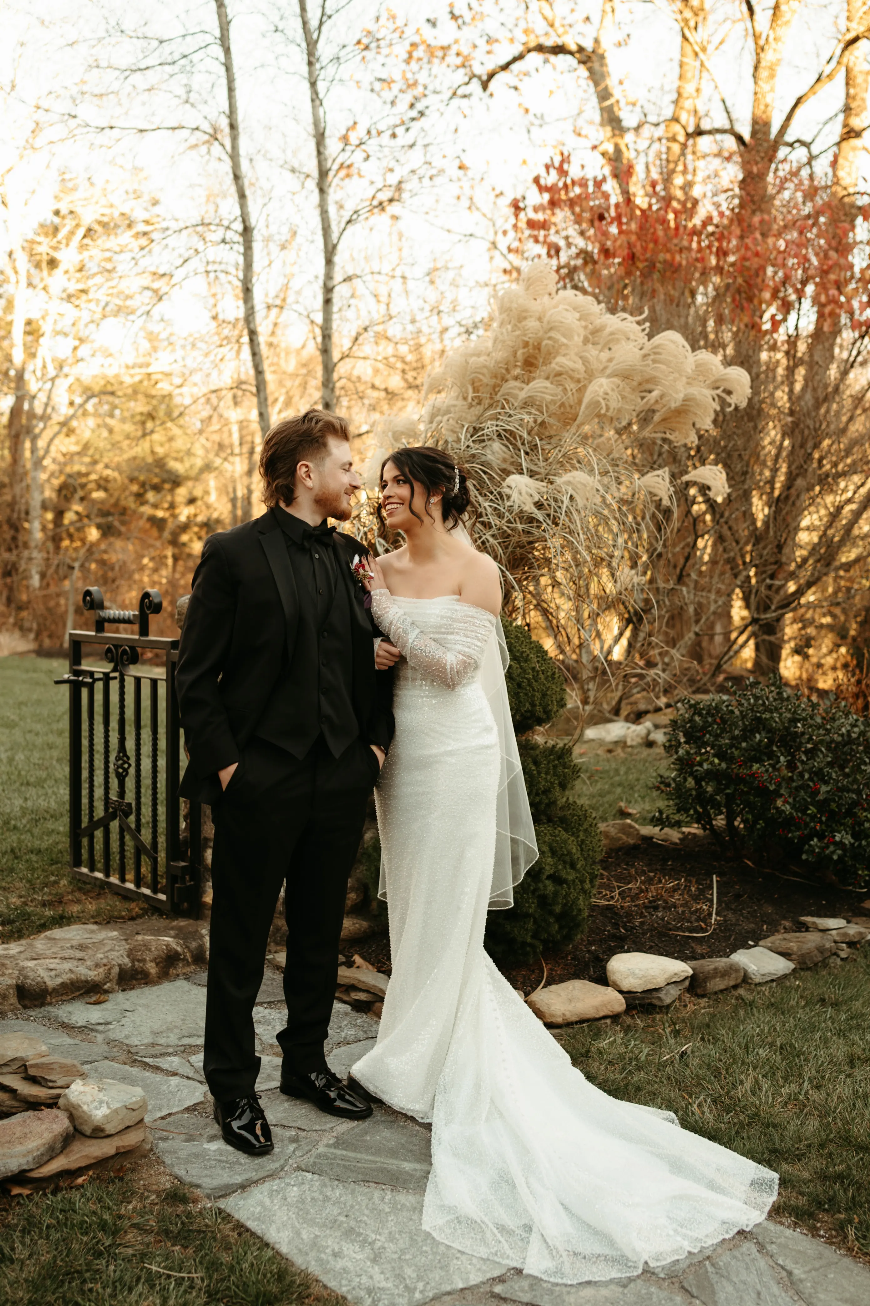 Bride Wearing Pearl Sparkly Wedding Dress Called Drew By Maggie Sottero With Groom In A Garden
