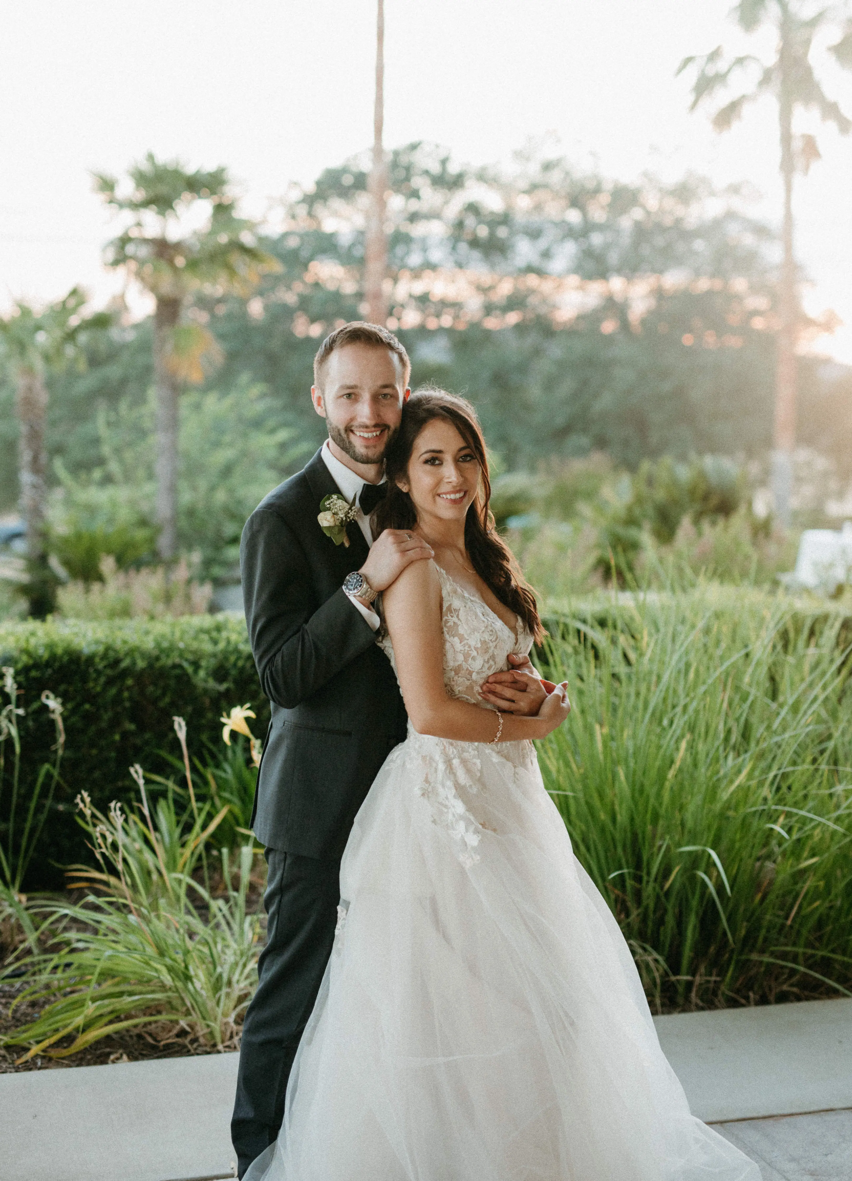 Groom with Bride in Magical A-Line Wedding Dress with Textured Illusion Motifs Called Minerva by Rebecca Ingram