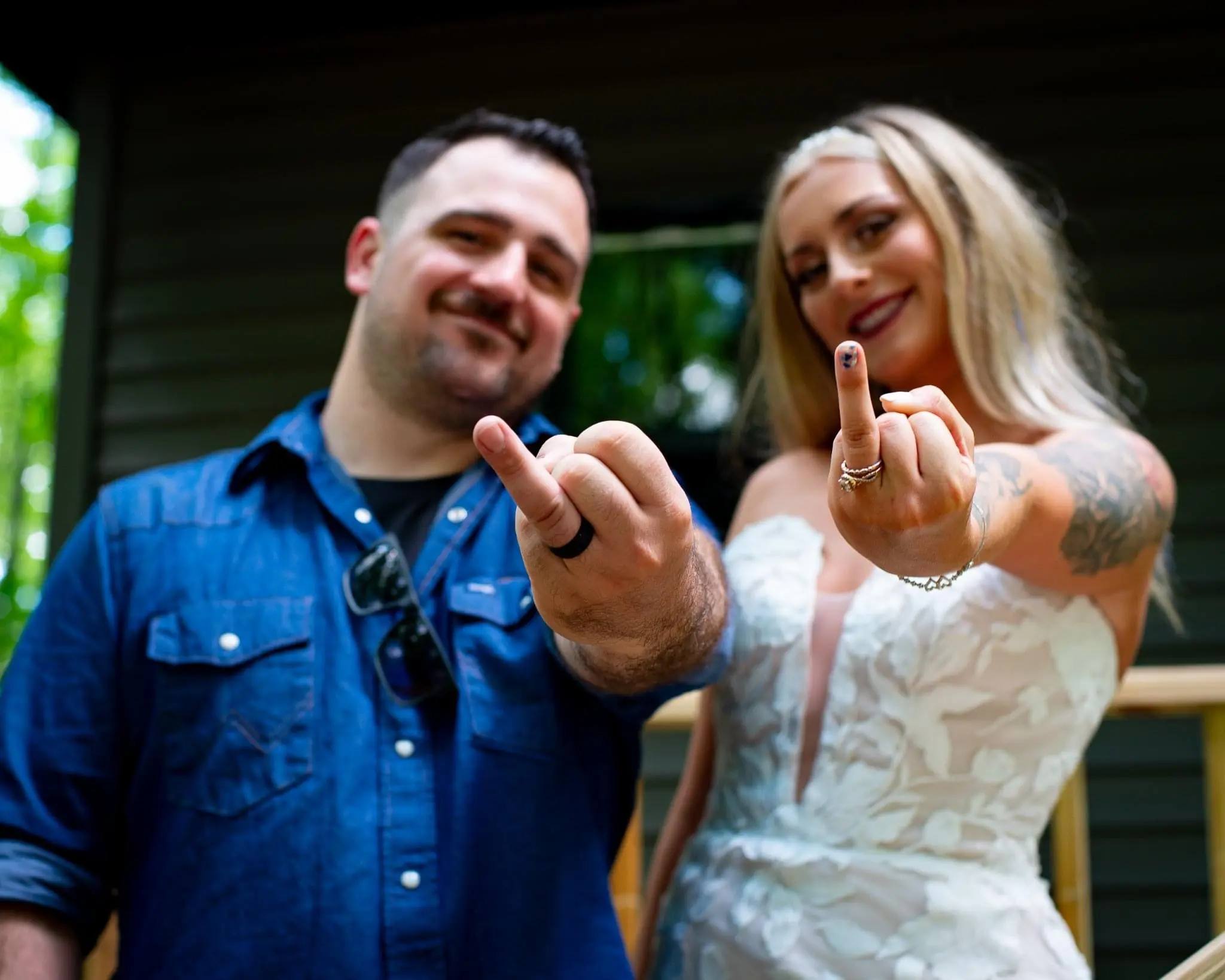 Bride Wearing Lace Strapless Mermaid Wedding Dress Called Hattie By Rebecca Ingram With Groom Showing Rings