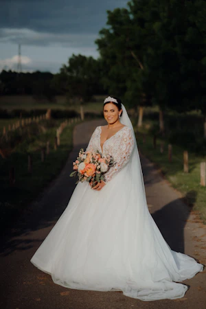 Bride In Long Sleeve Lace Ball Gown Wedding Dress Called Mallory Dawn By Maggie Sottero