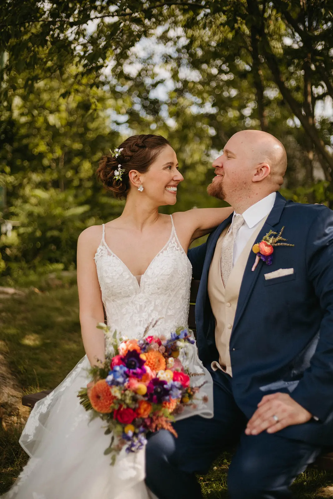 Bride In Floral Lace Bridal Gown Named Lettie By Rebecca Ingram Bride And Groom Looking At Each Other