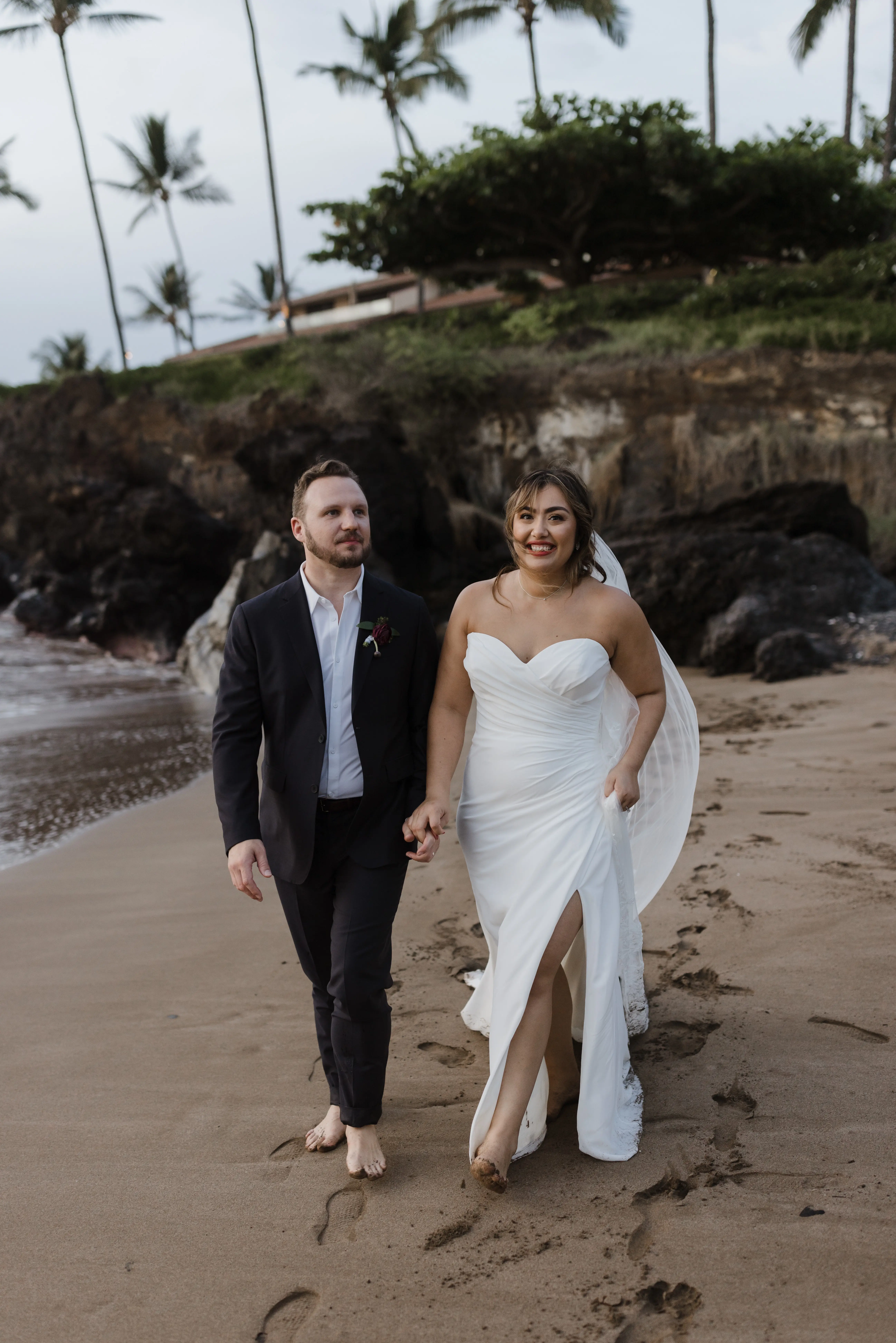 Bride On Beach With Groom In Strapless Wedding Dress Called Monaco By Maggie Sottero
