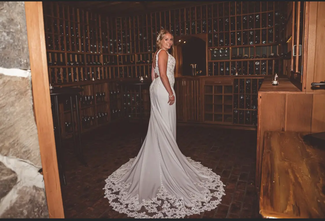 Bride wearing lace crepe wedding dress