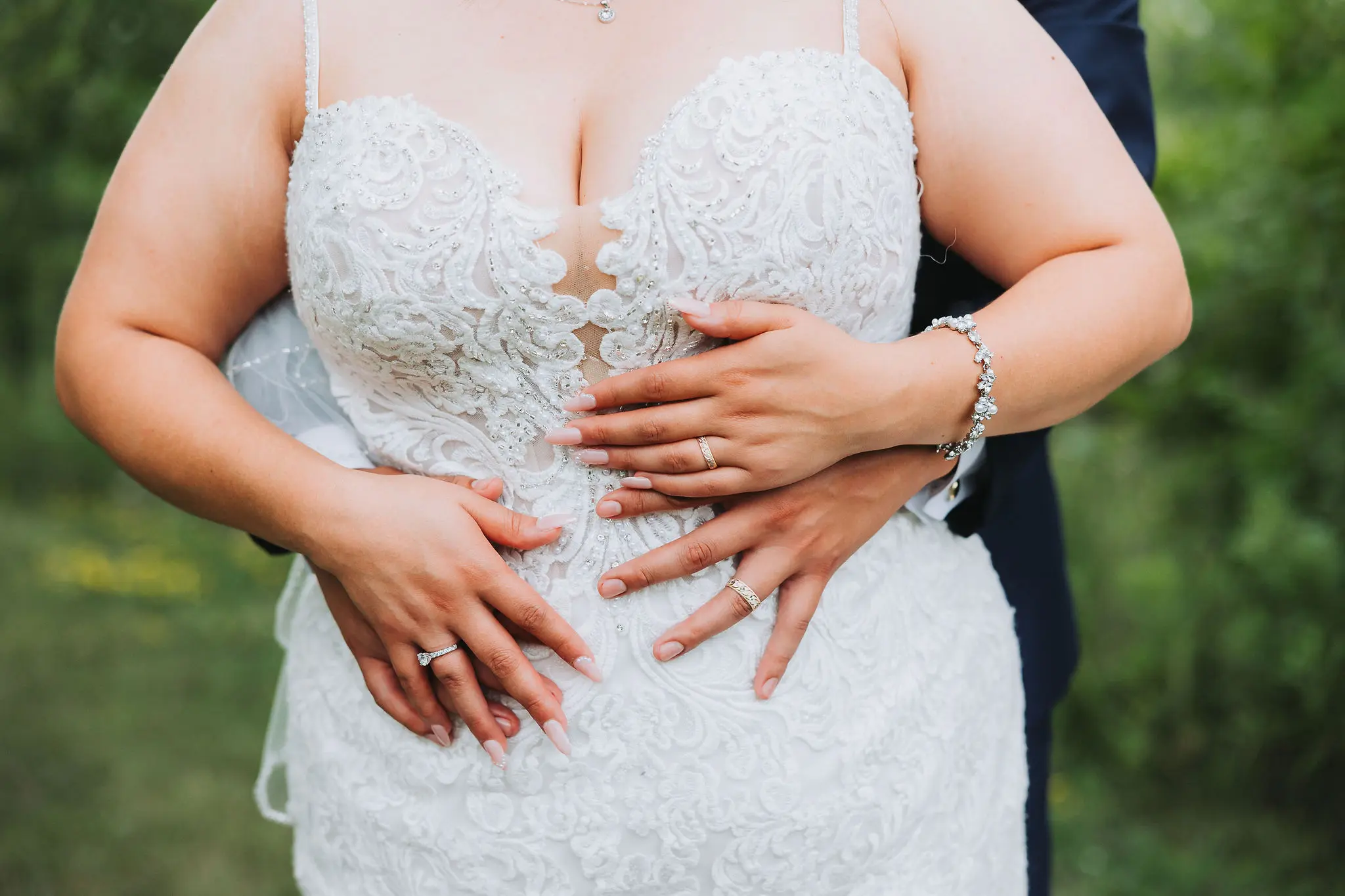 Bride wearing Fiona wedding dress by Maggie Sottero being held by her husband