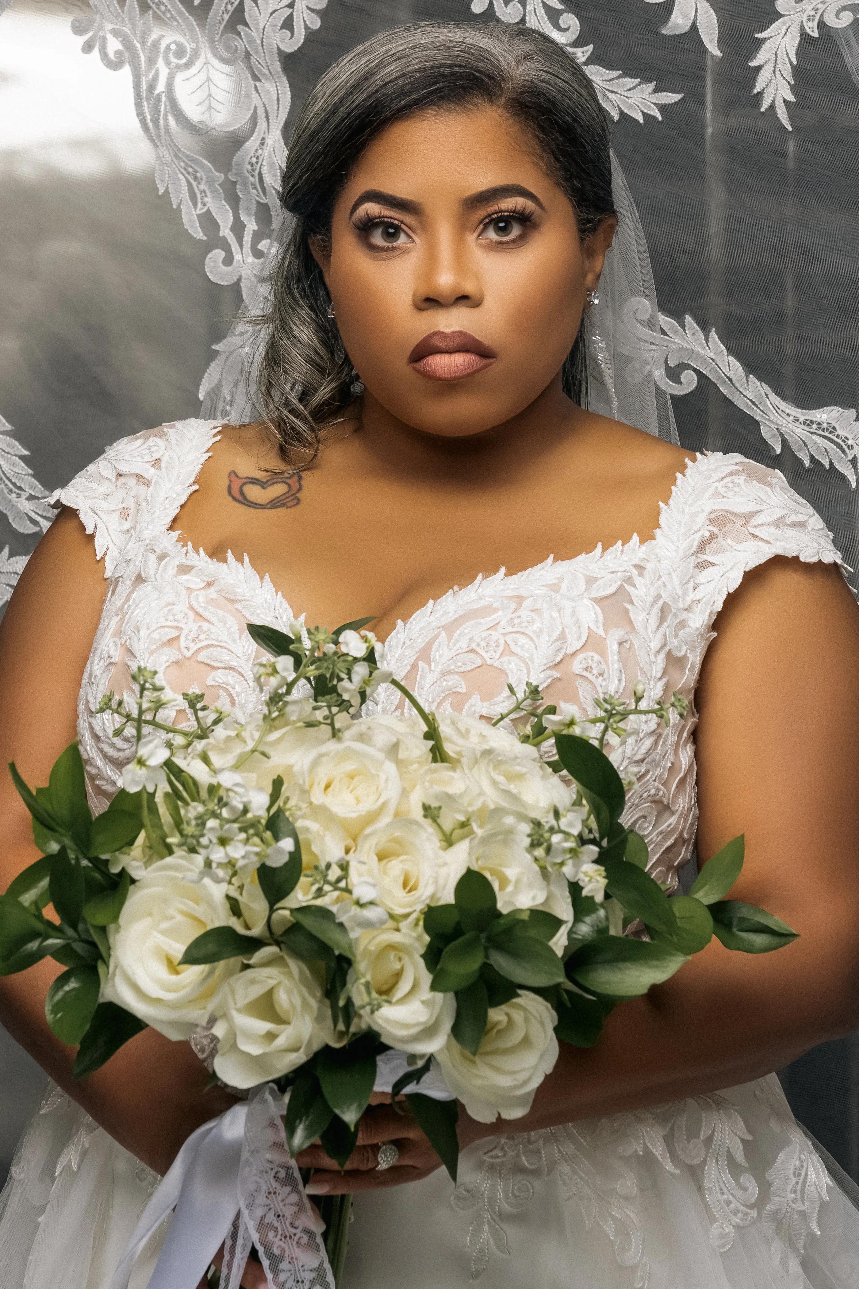 Bride Wearing Chic Crepe Wedding Gown Called Anson By Sottero And Midgley Holding White Rose Bouquet