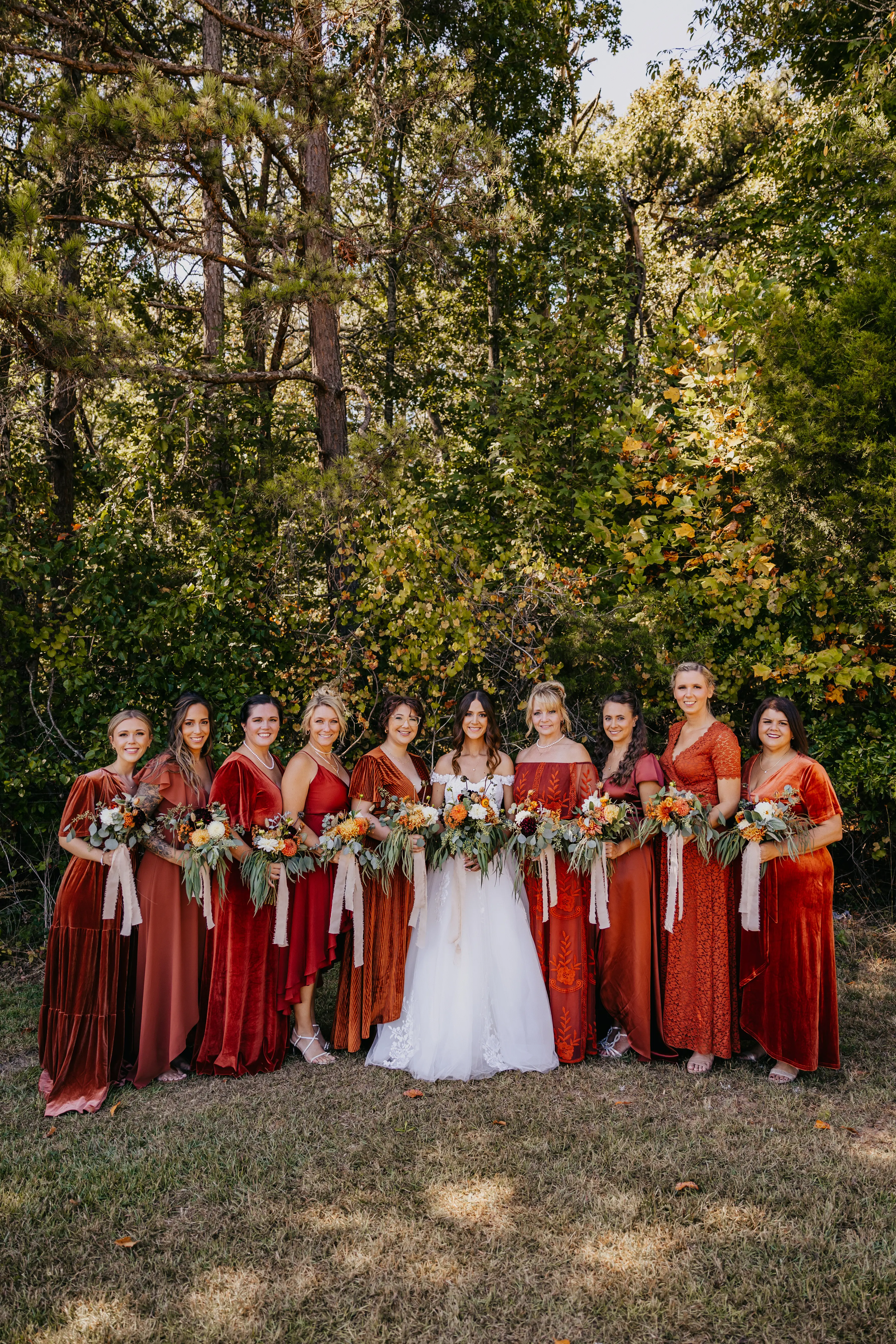 Bride wearing Harlem wedding dress by Maggie Sottero with her bridesmaids