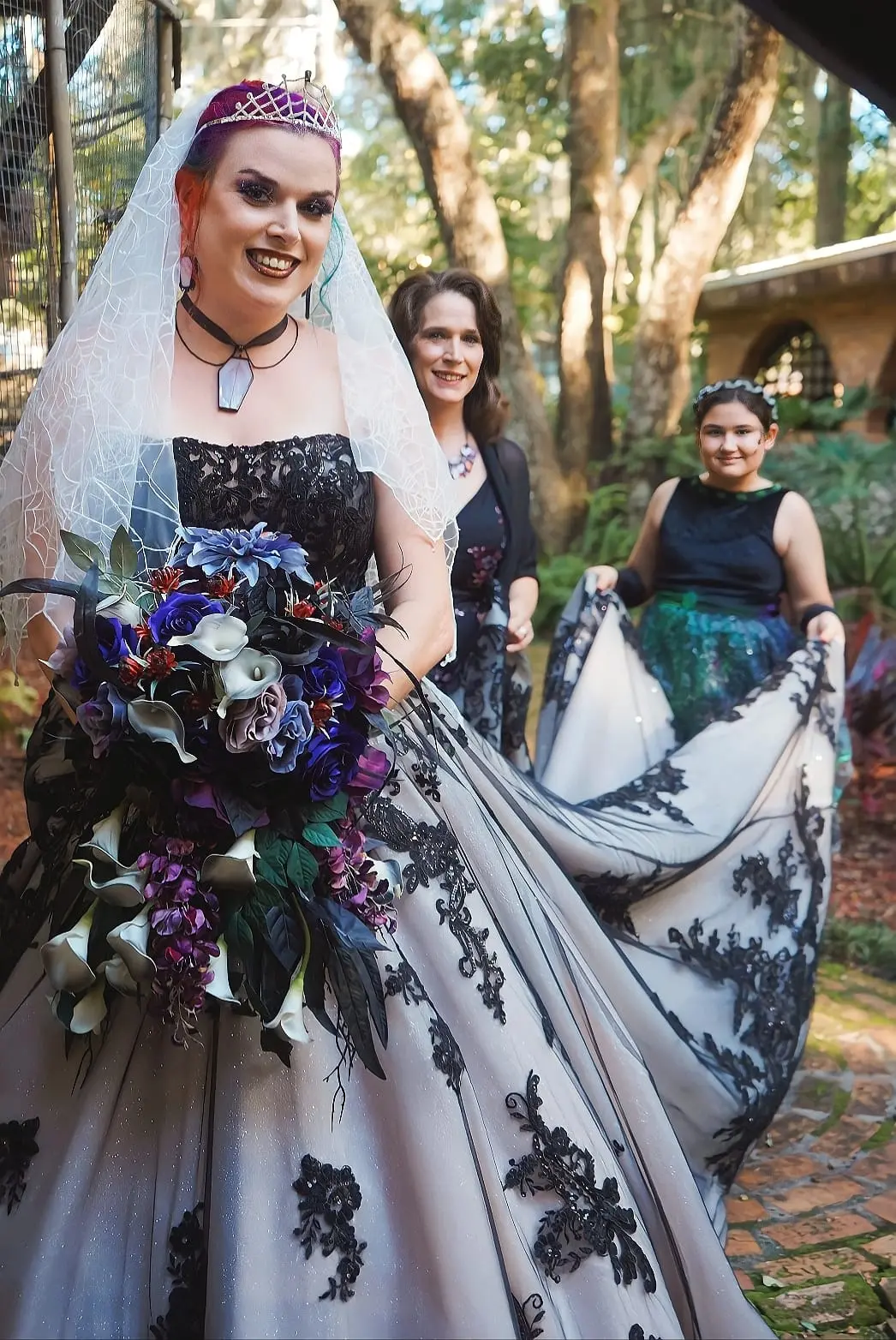 Bride Wearing Black Lace Wedding Dress Called Norvinia By Sottero and Midgley With Mom and Flower Girl