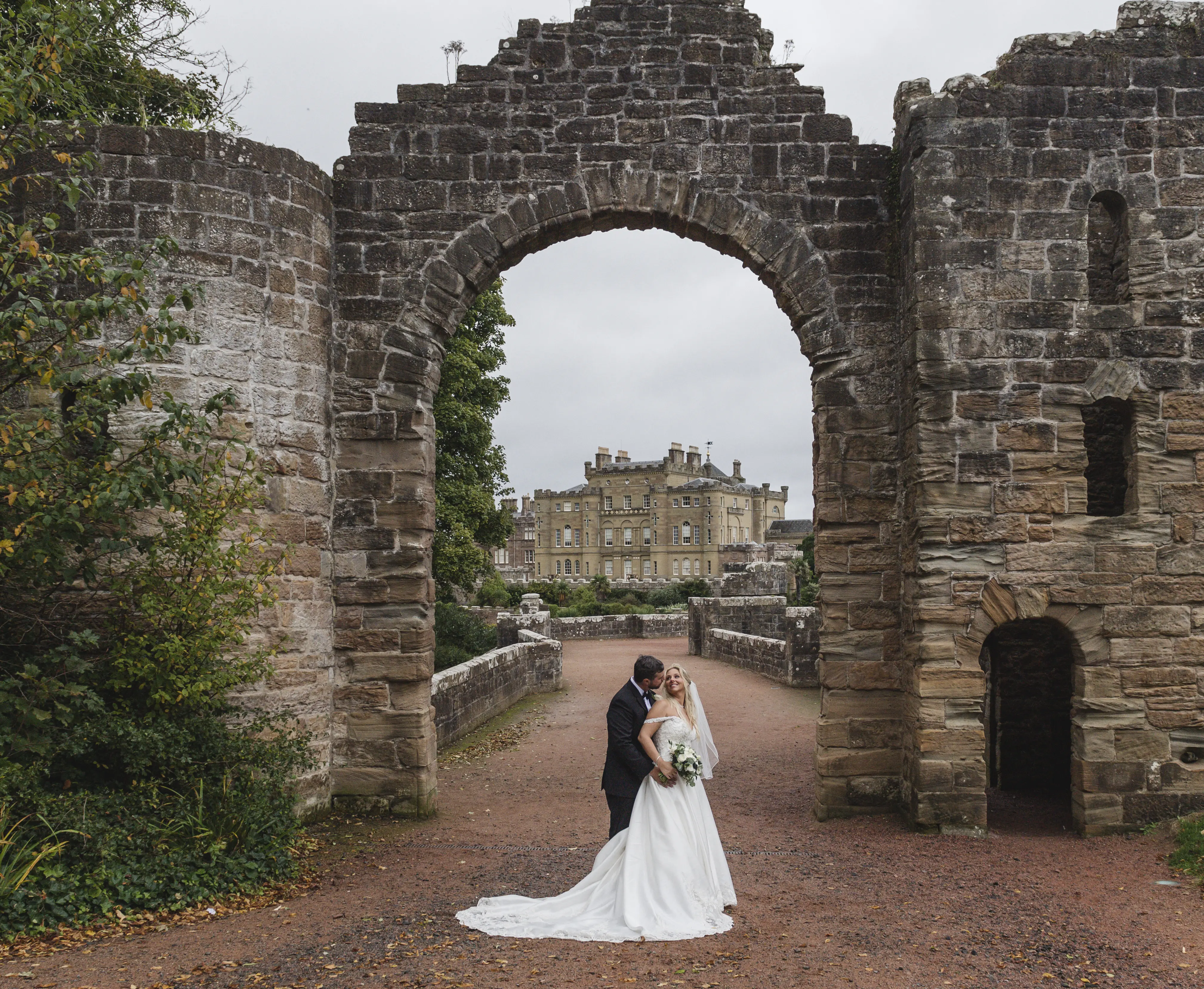 Bride In Satin Wedding Dress Called Kimora By Sottero And Midgley With Groom