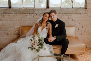 Bride Wearing Floral Ethereal Tulle Wedding Dress Called Lettie By Rebecca Ingram With Groom On Couch