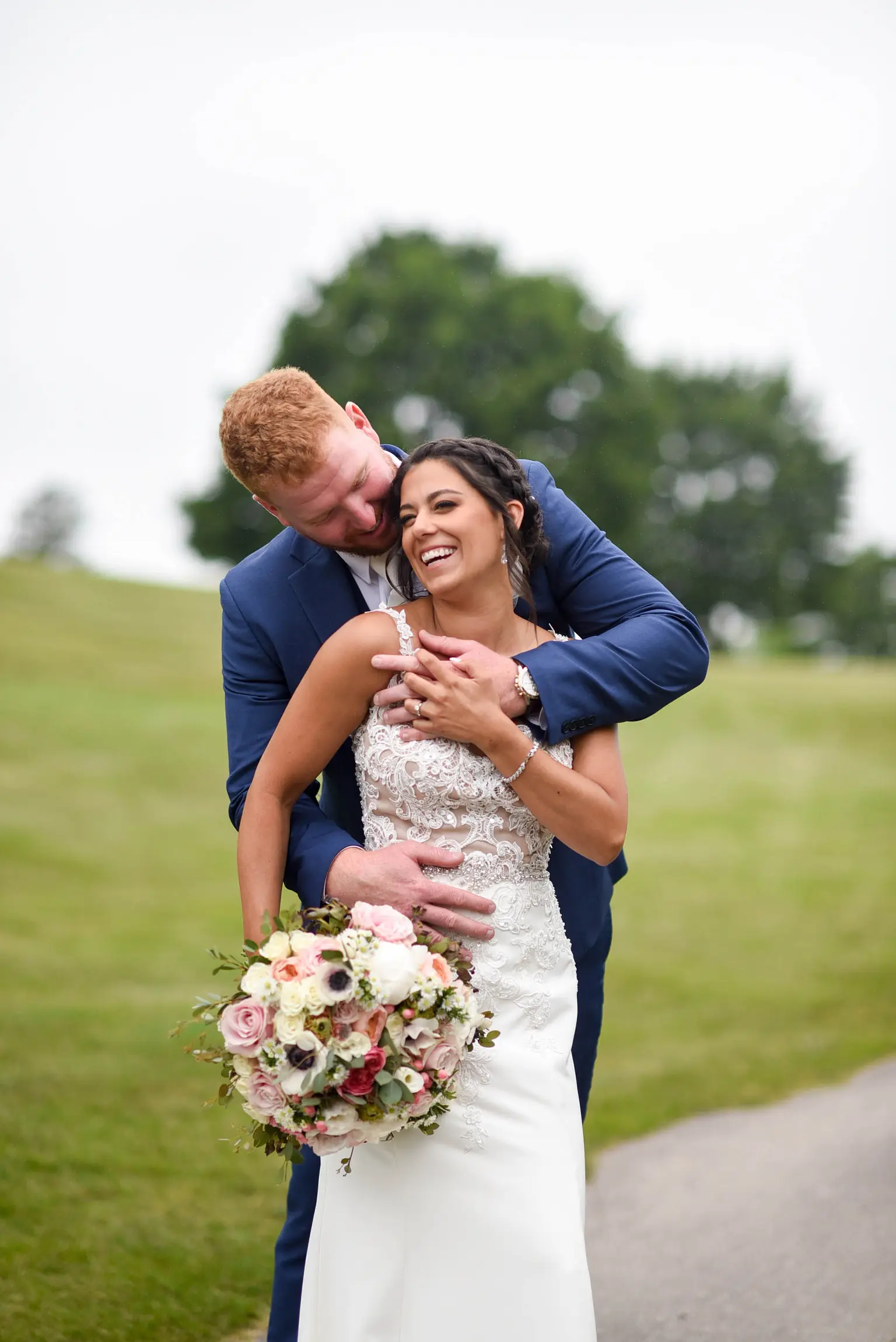 Bride with groom wearing crepe sheath wedding dress