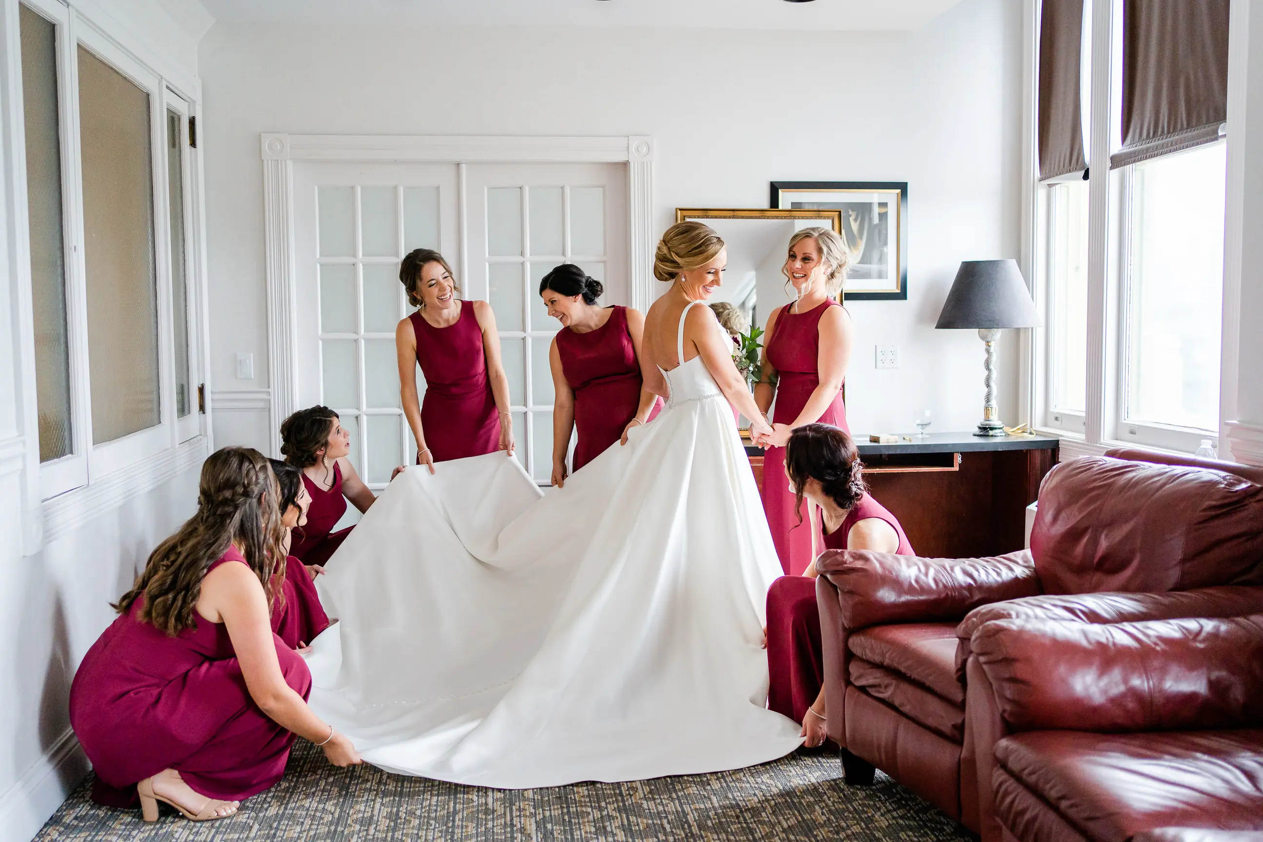 Bride wearing Simple Ballgown Wedding Dress called Selena by Maggie Sottero with her bridesmaids