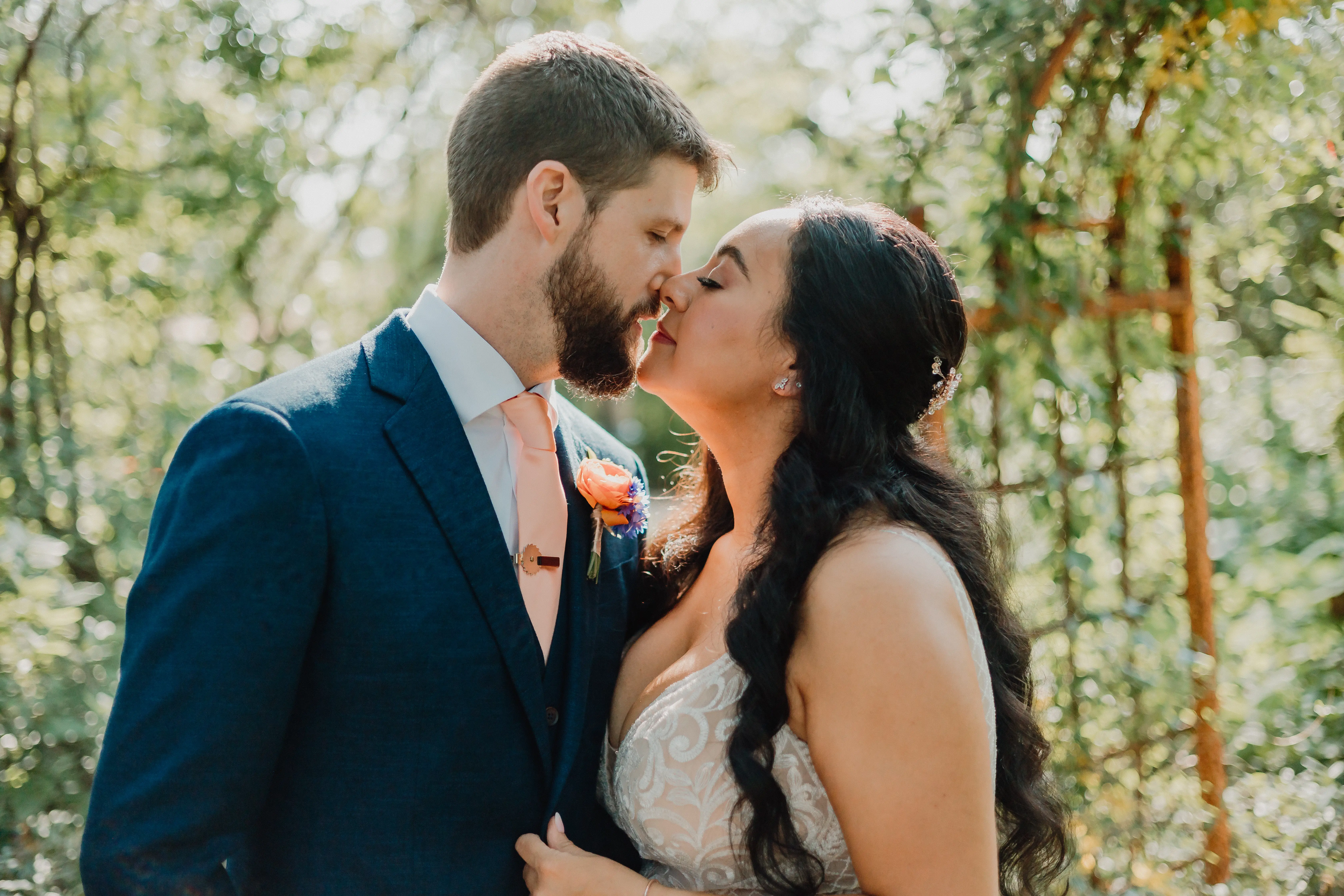 Groom Kissing Bride In Lacey Spaghetti Strap Wedding Dress Named Roxanne By Sottero And Midgley