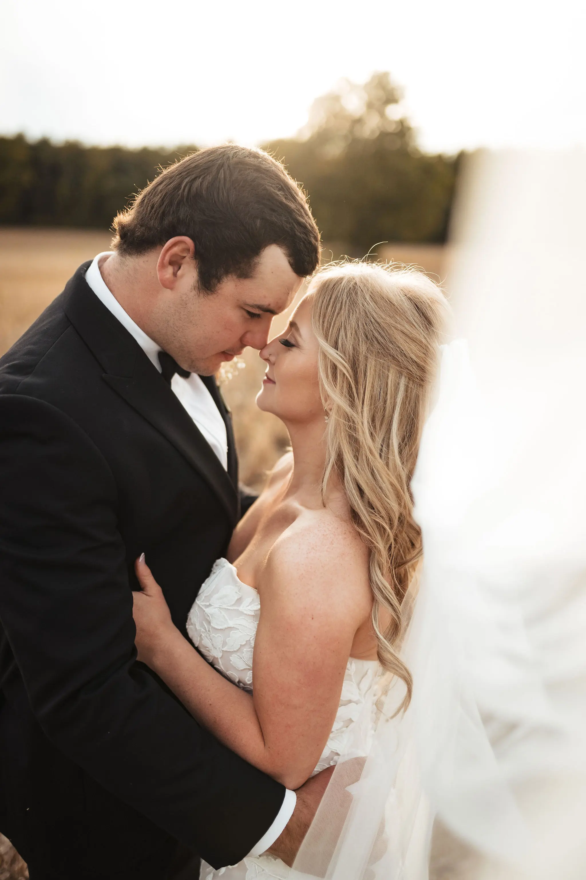 Bride in oversized lace wedding dress called Hattie by Rebecca Ingram with groom first look