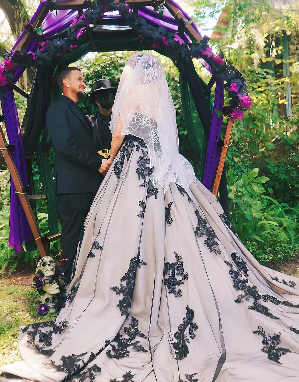 Bride Wearing Black Lace Wedding Dress Called Norvinia By Sottero and Midgley With Groom At The Ceremony