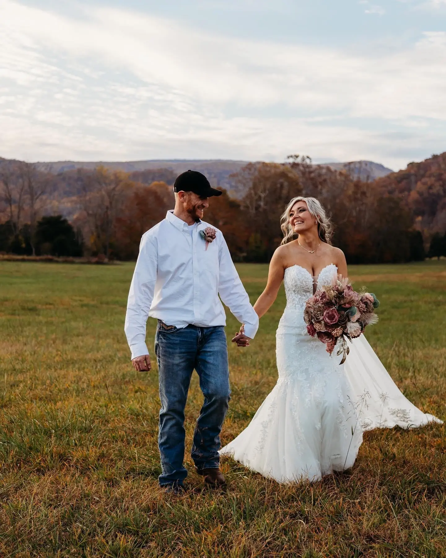 Bride wearing Lennon wedding dress by Maggie Sottero with her husband