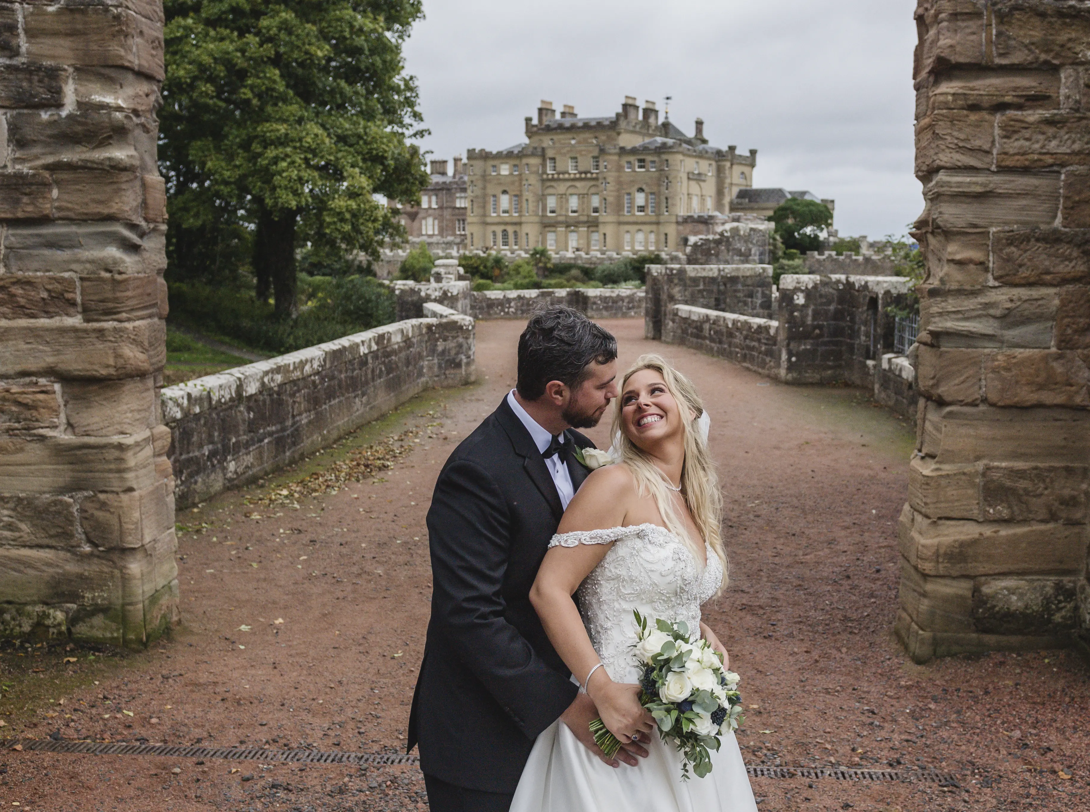 Bride In Satin Wedding Dress Called Kimora By Sottero And Midgley With Groom