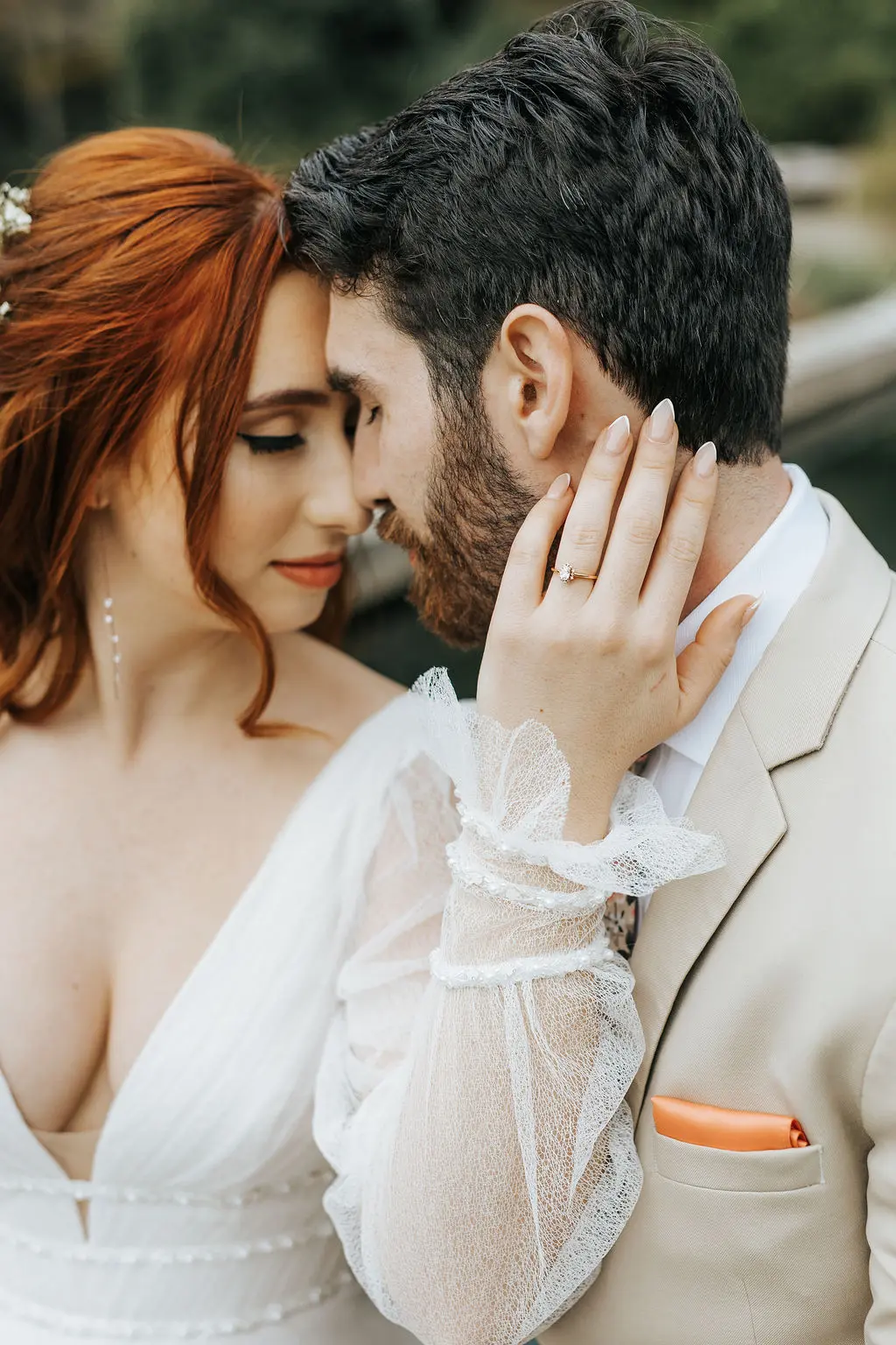 Bride Wearing Sexy Long Sleeve A-Line Wedding Dress Holding Groom Outdoors.