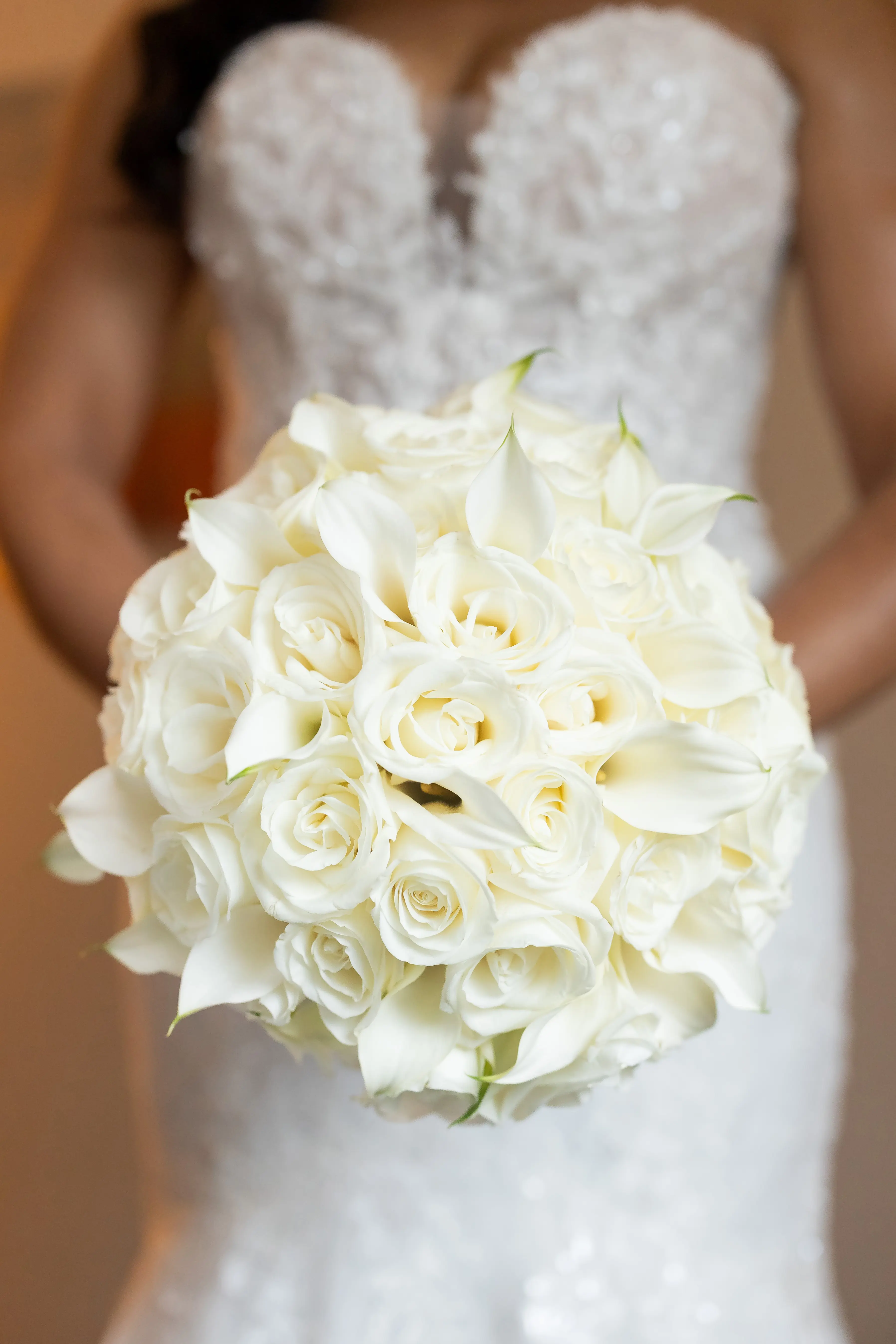 Bride Wearing Sexy Lace Wedding Dress Called Lennon By Maggie Sottero With A White Rose Bouquet