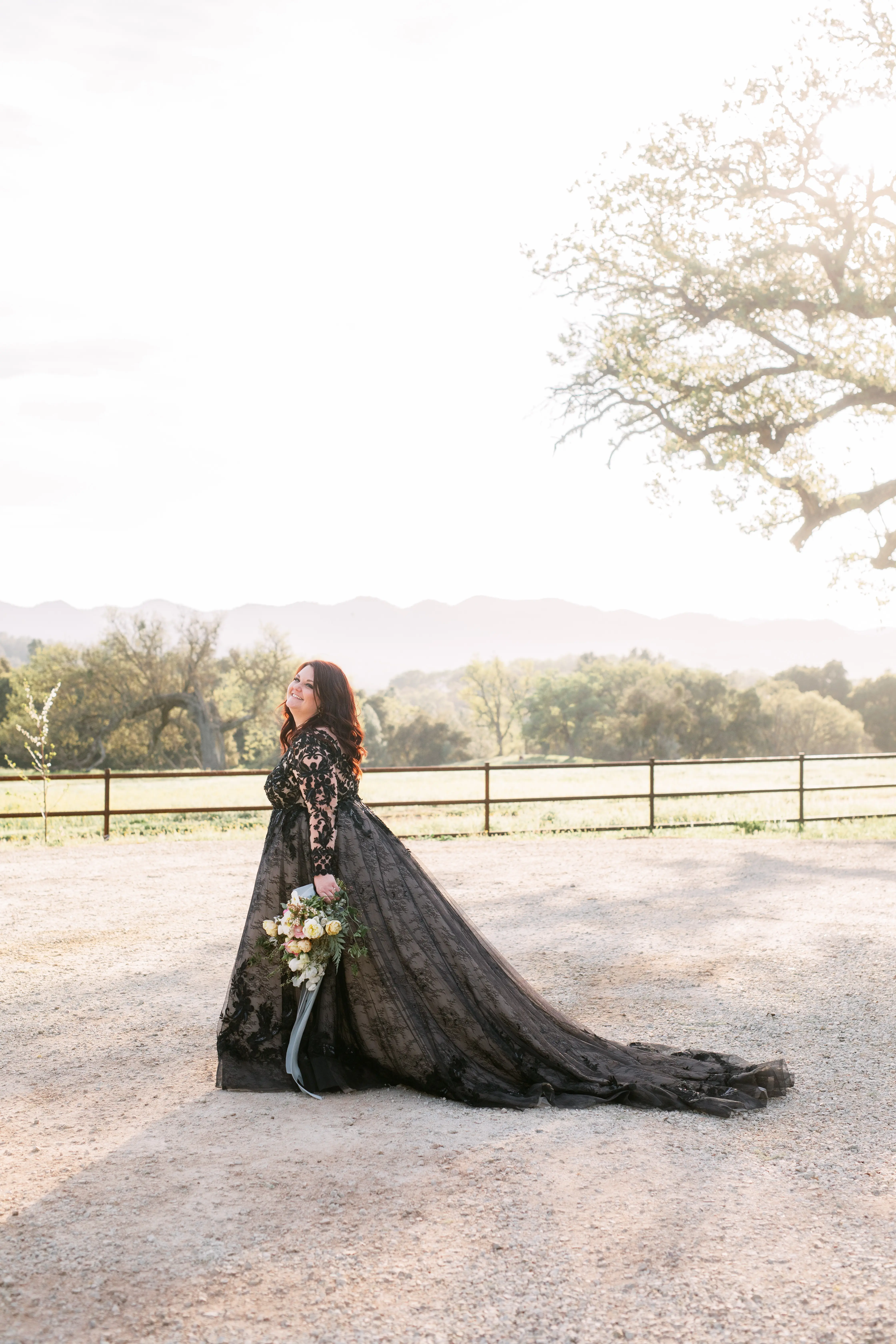 Bride wearing black ball gown wedding dress called Zander.