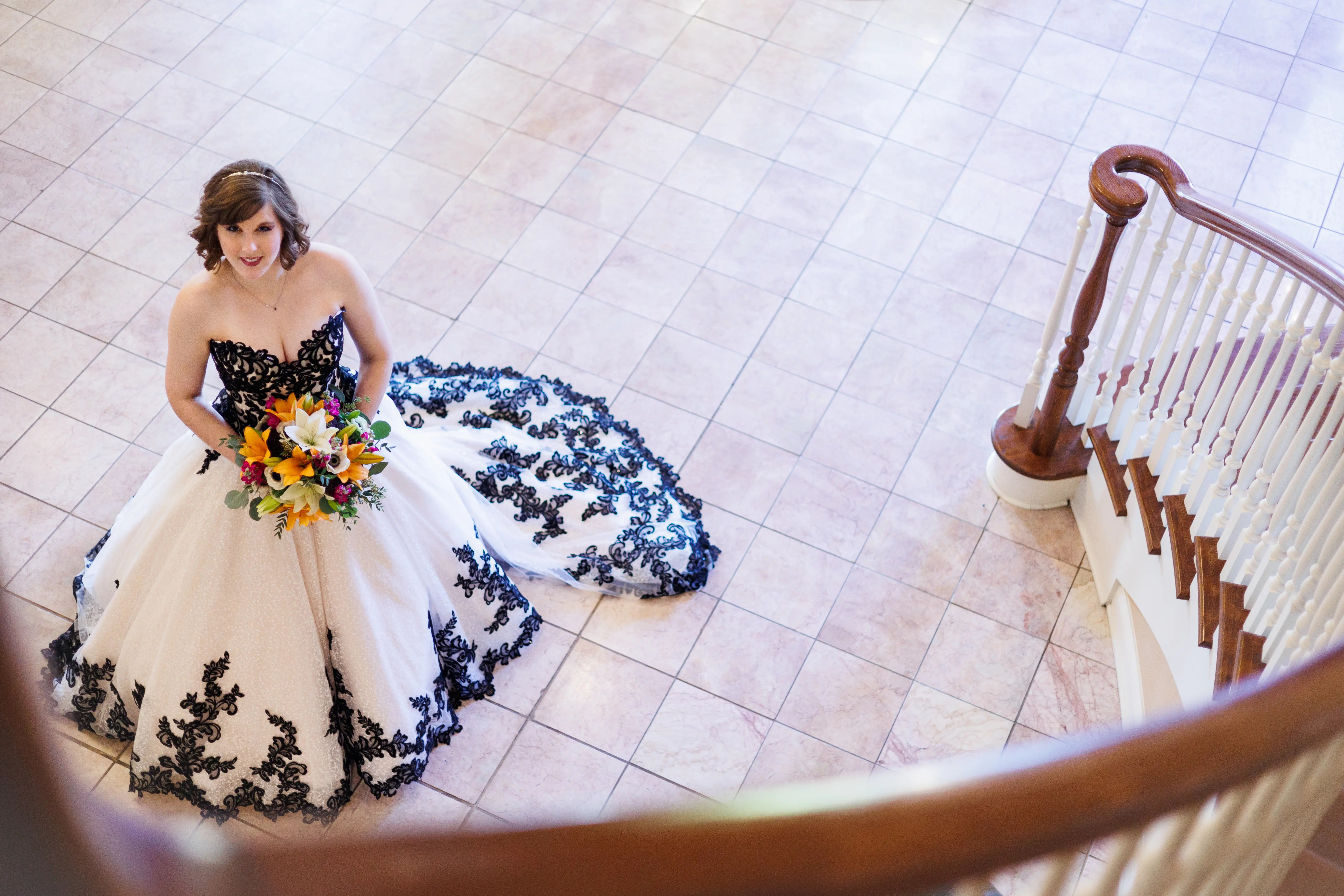 Bride Wearing Black And White Lace Strapless Ball Gown Called Tristyn By Maggie Sottero