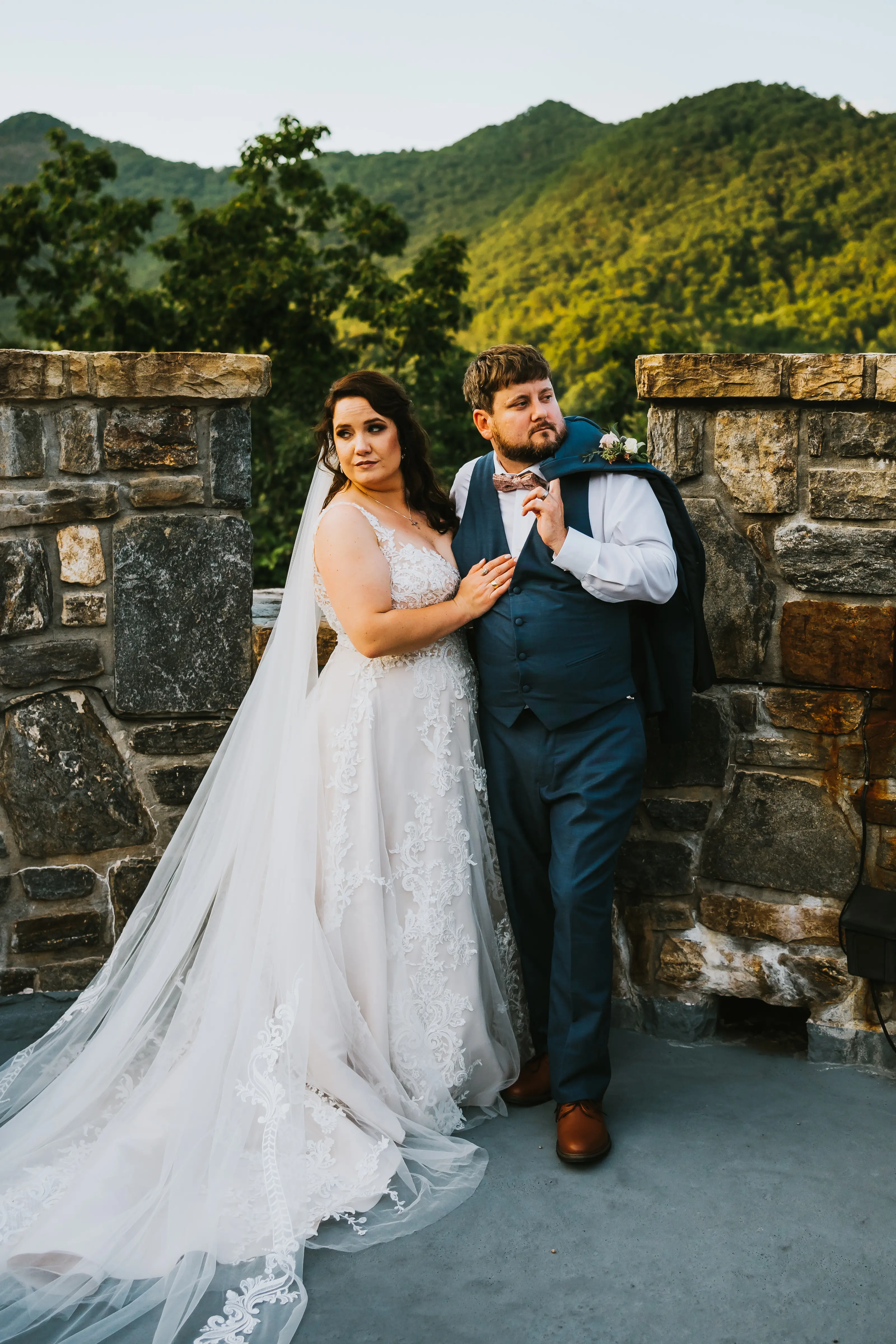Bride Wearing Shimmery Princess Bridal Gown Called Tiffany By Maggie Sottero Posing With Groom