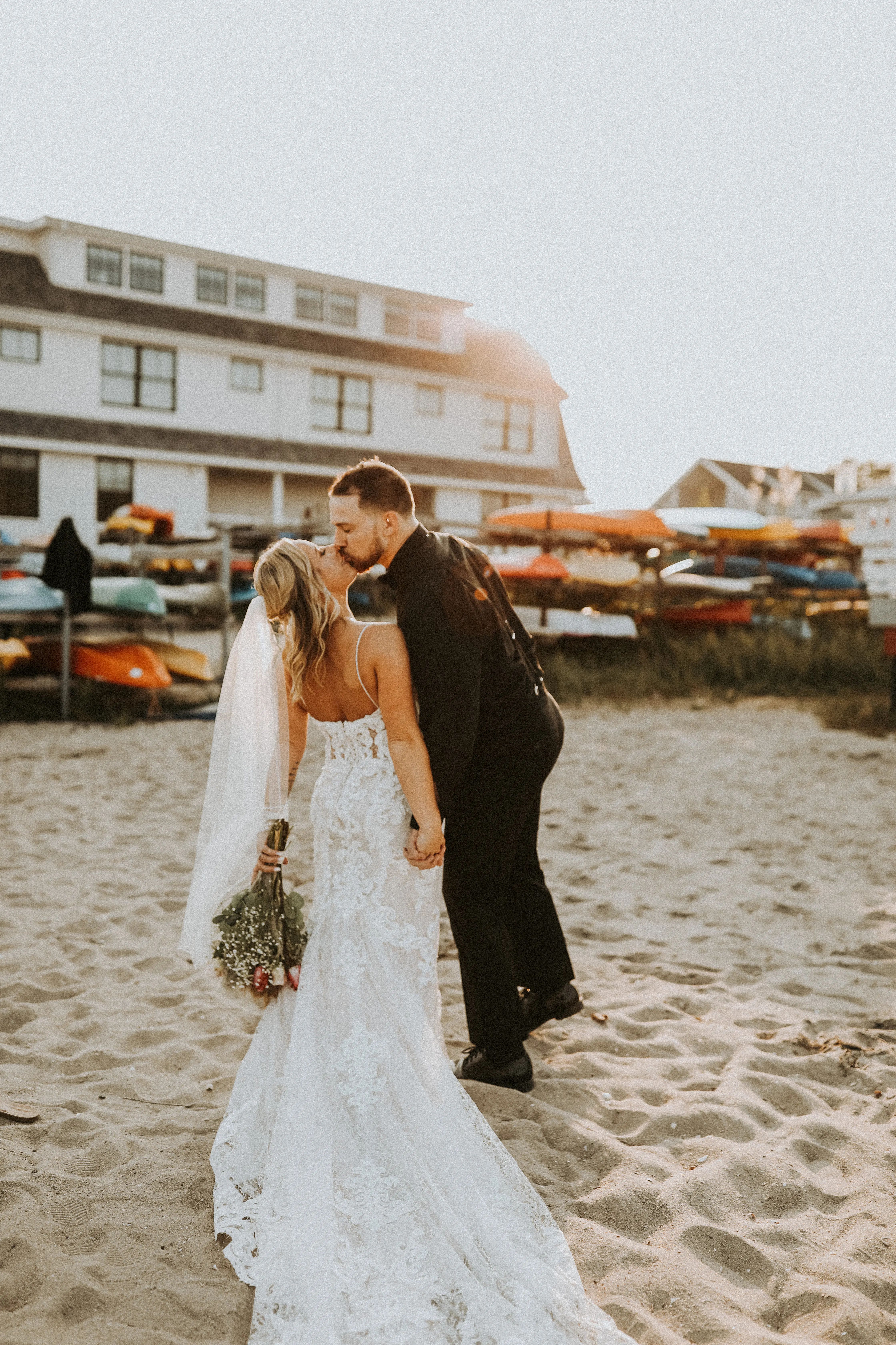 Bride In Lace Sheath Wedding Gown Name Tuscany Lynette By Maggie Sottero Bride And Groom Kissing