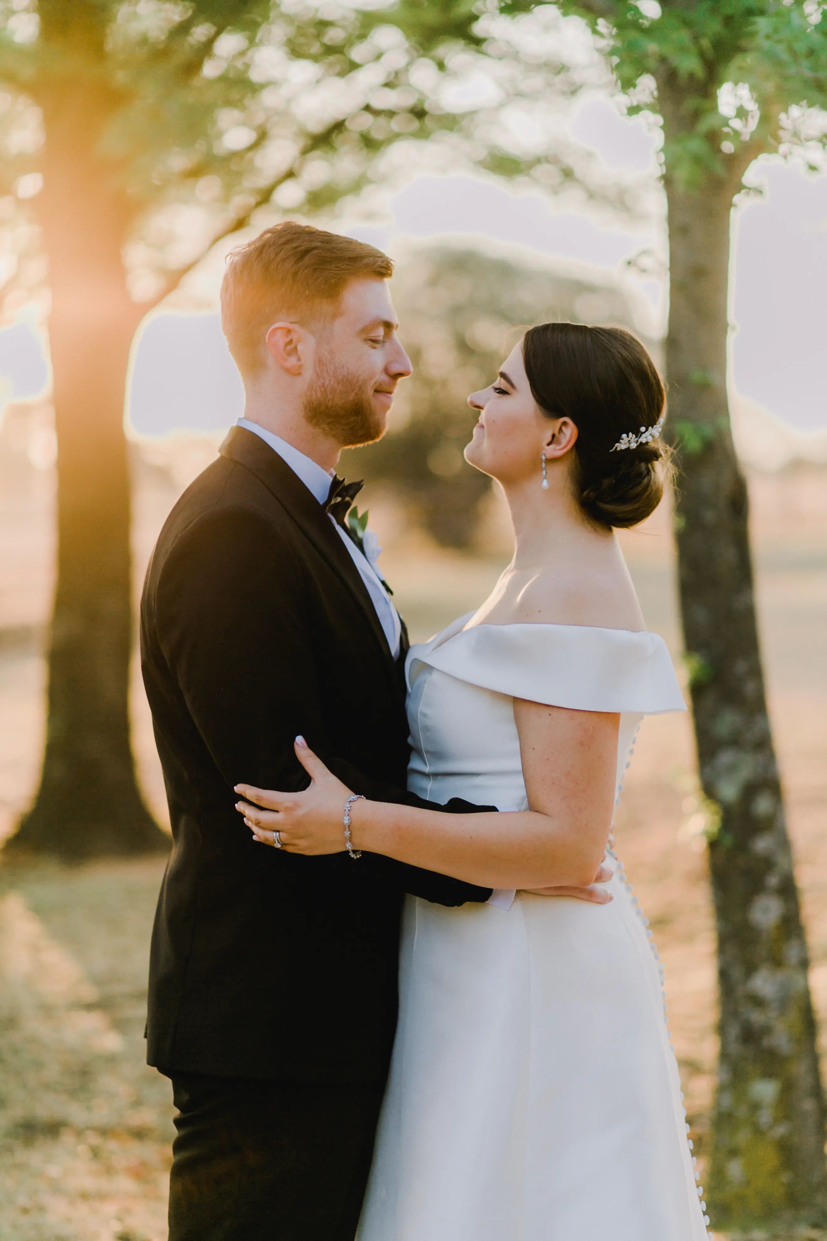 Bride Wearing Off-The-Shoulder A-Line Wedding Dress Called Coral By Rebecca Ingram With Groom