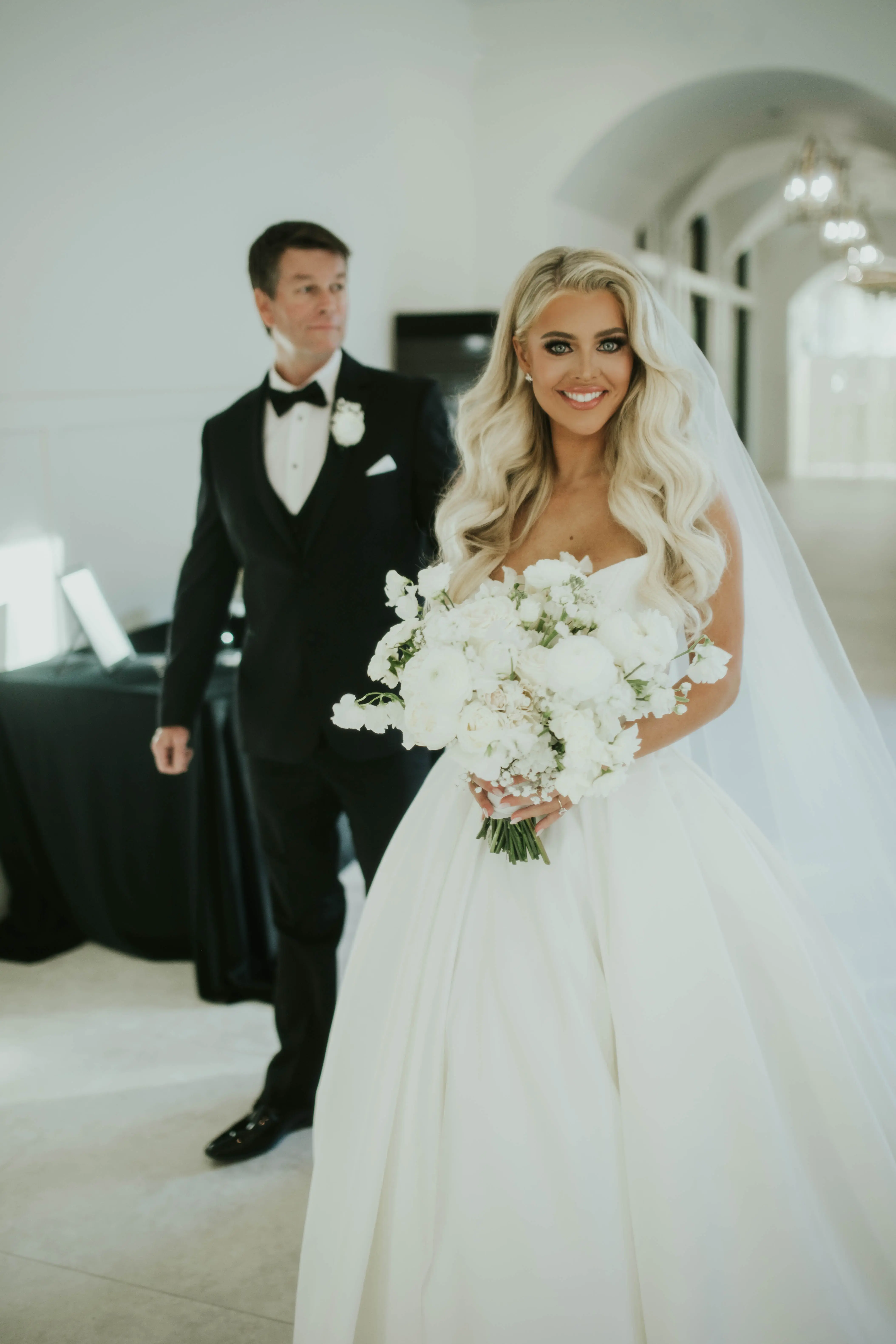 Bride wearing Derrick by Maggie Sottero with her husband