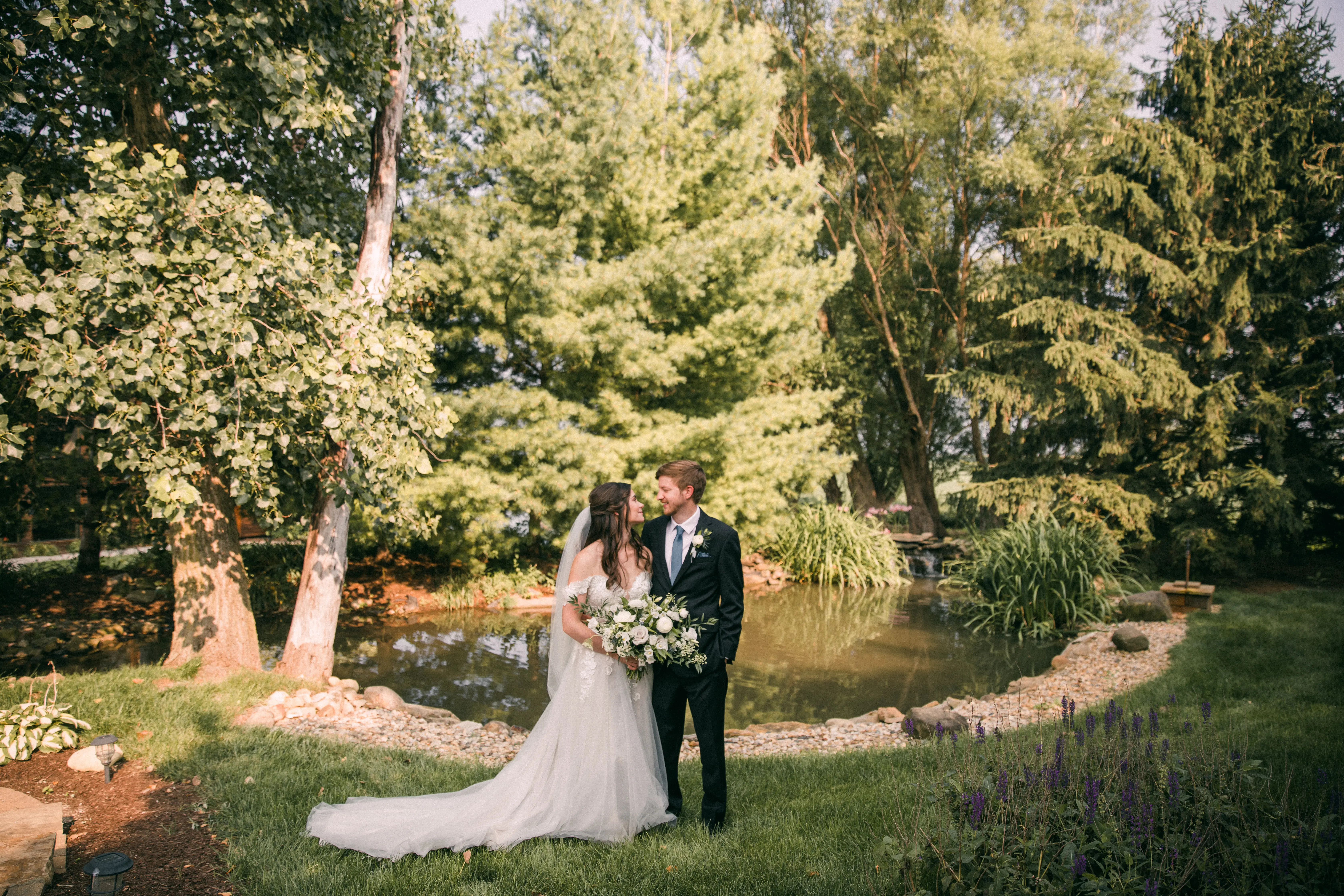 Groom With Bride Wearing A-Line Lace Wedding Dress With Customized Off The Shoulder Sleeves Stevie By Maggie Sottero