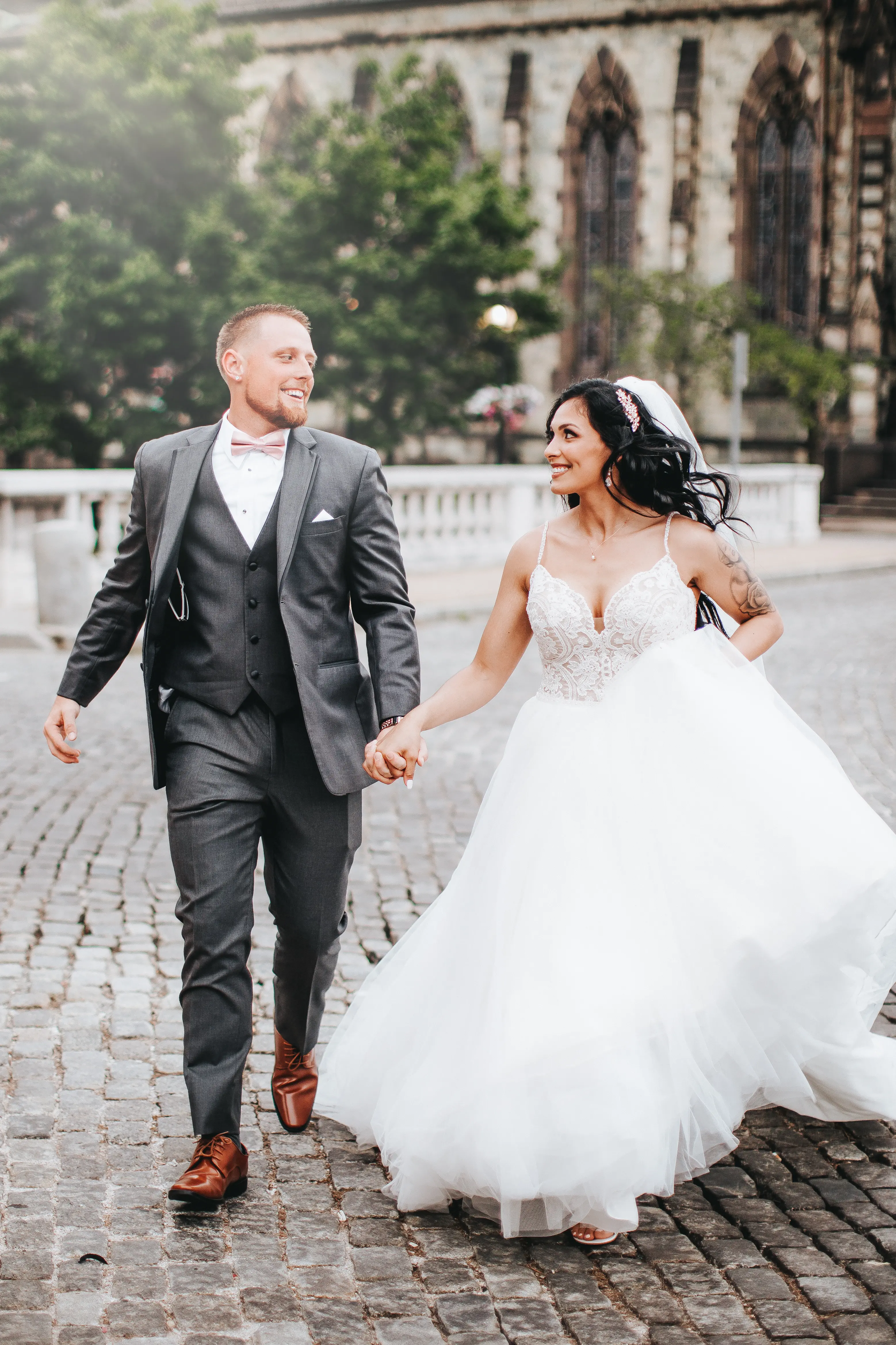 Bride with groom wearing boho princess wedding dress