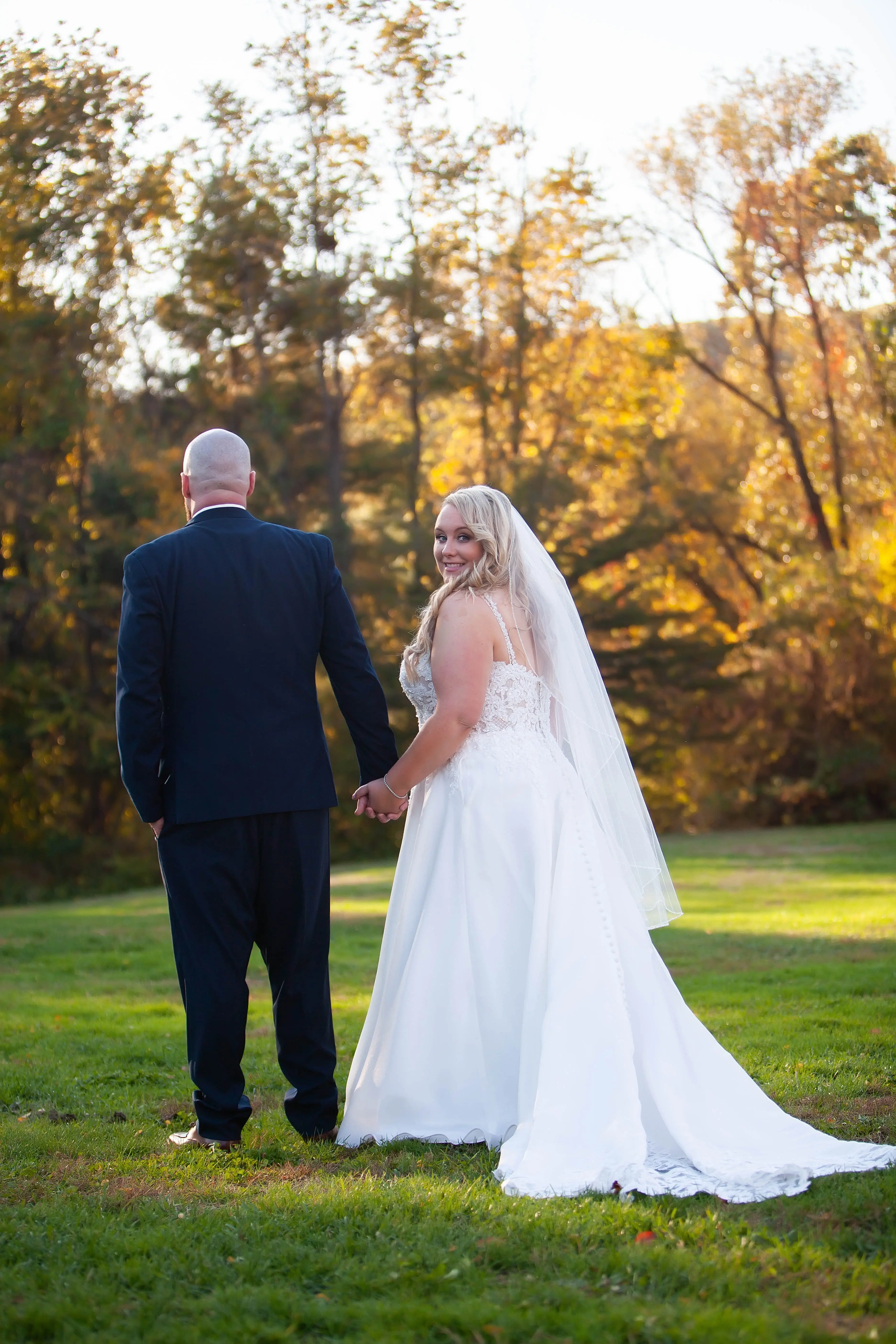 Bride Wearing Lace Ballgown Wedding Dress Called Savannah By Maggie Sottero Walking With Groom