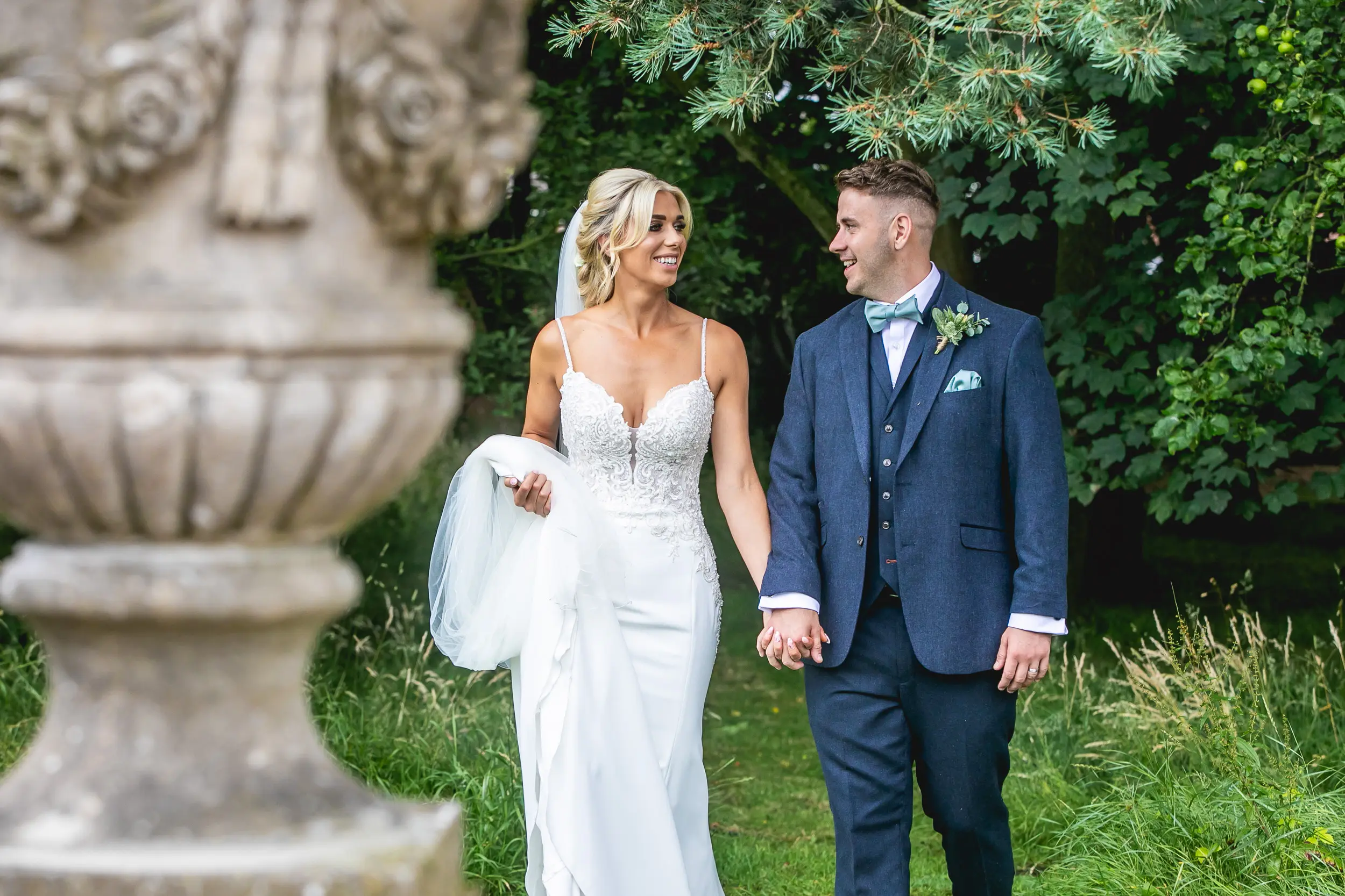 Bride and groom looking at each other smiling.