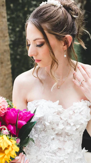Bride Wearing A-Line Wedding Dress With 3-D Floral Motifs.