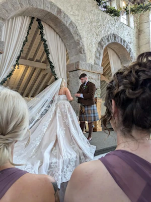 Bride wearing Norvinia by Sottero and Midgley being married