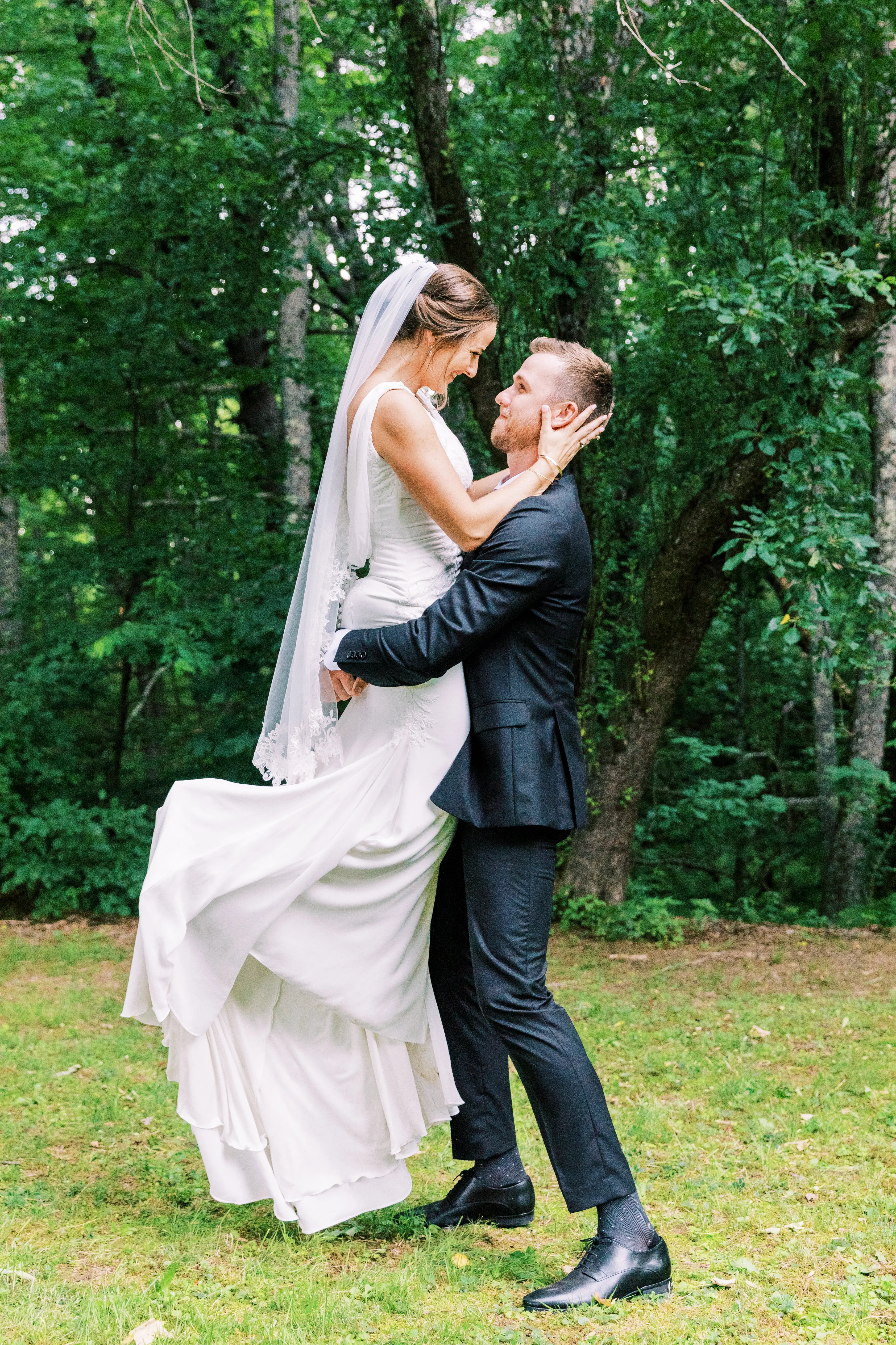 Groom with bride wearing simple crepe wedding dress Bertina by Maggie Sottero.