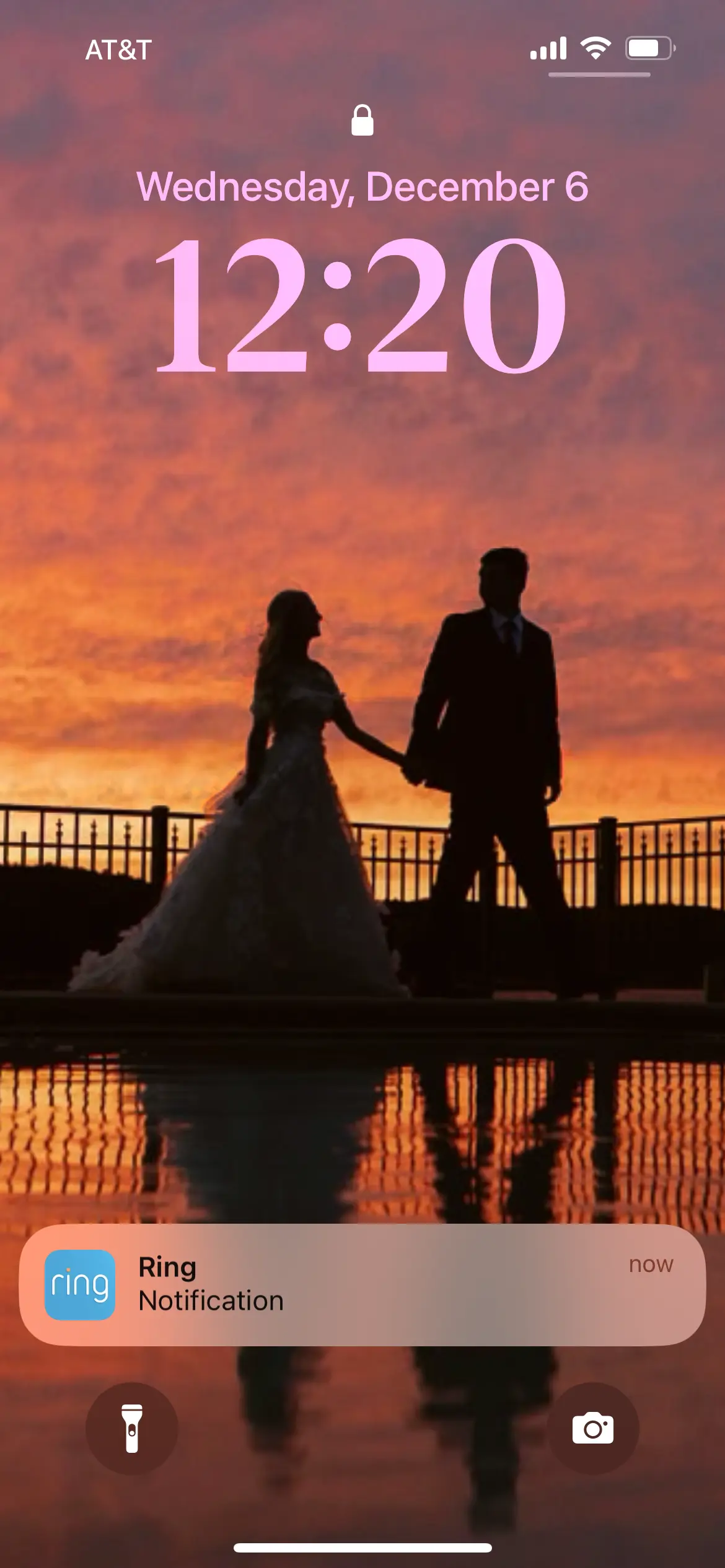 Bride wearing Laila wedding dress by Maggie Sottero walking with her husband