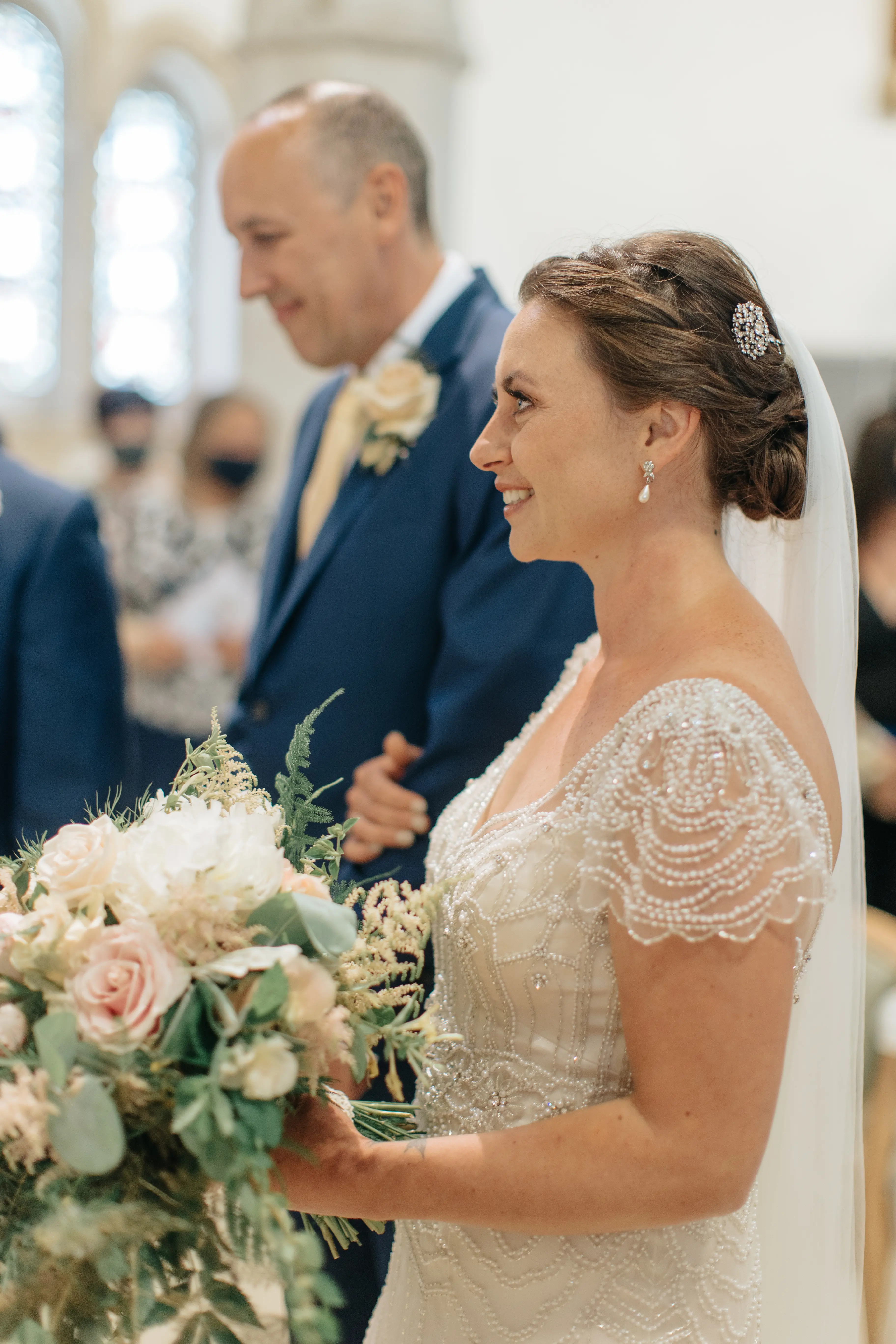 Bride Wearing Ivory Satin Sheath Wedding Dress Ettia By Maggie Sottero