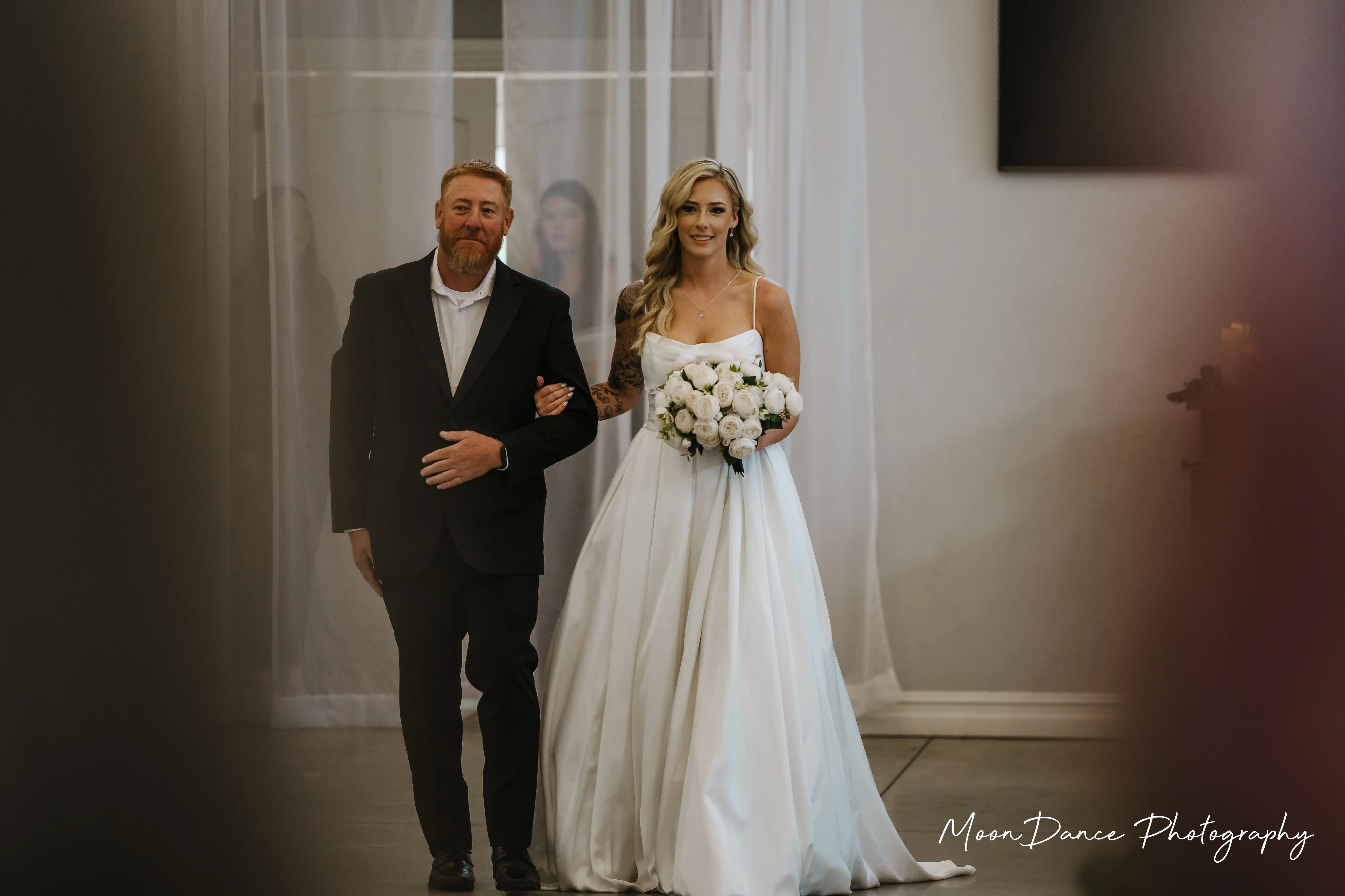 Bride Wearing Aline Satin Wedding Gown Called Scarlet By Maggie Sottero Walking With Dad Down The Aisle
