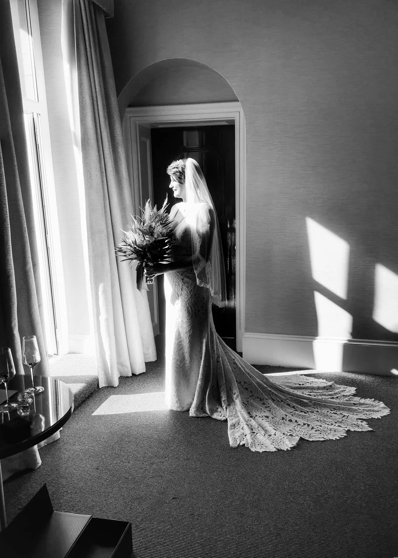 Bride Wearing Boho Lace Wedding Dress Called Burke By Maggie Sottero Looking Out A Window