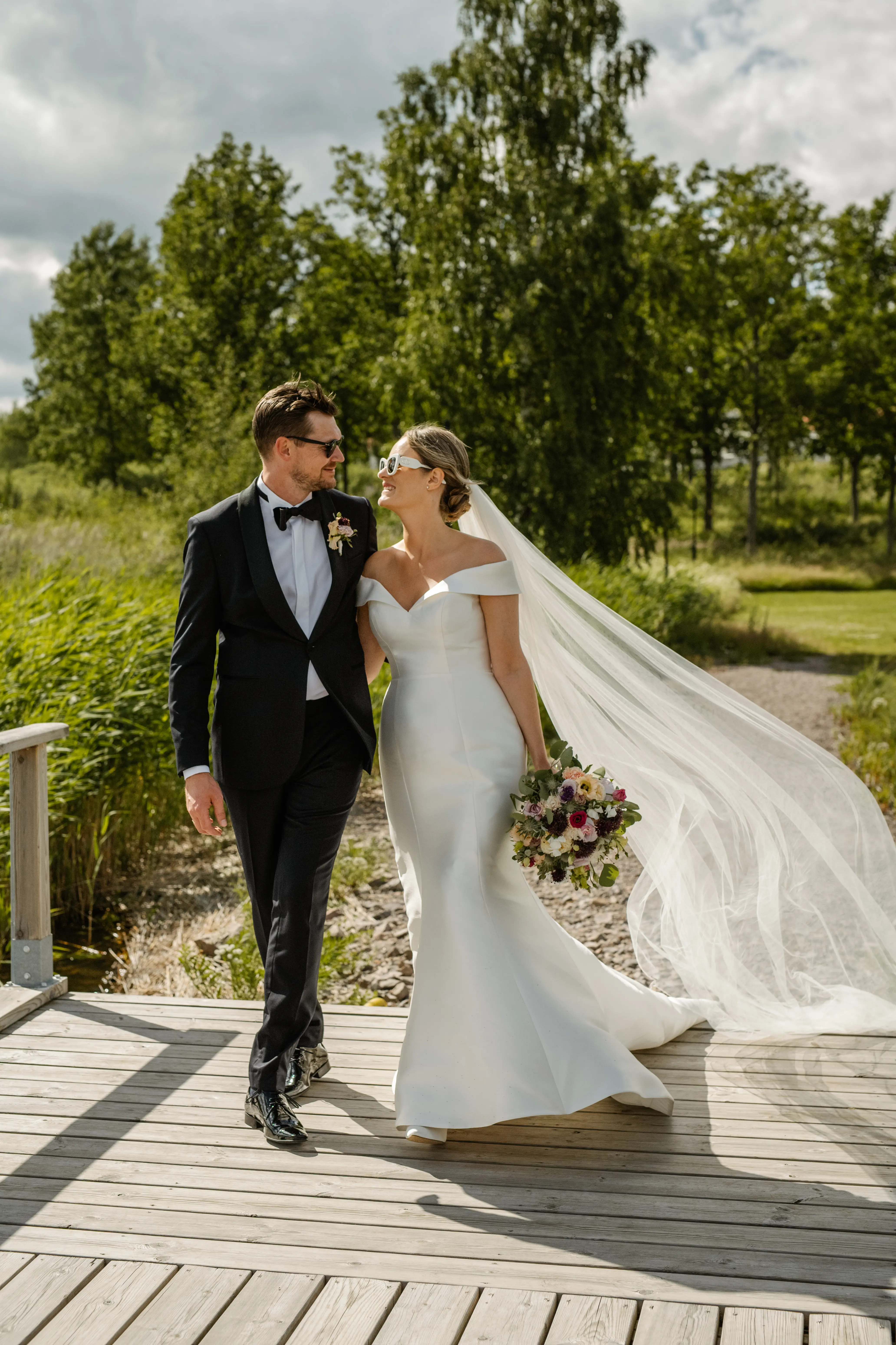 Groom With Bride Wearing Off The Shoulder Fit And Flare Josie By Rebecca Ingram