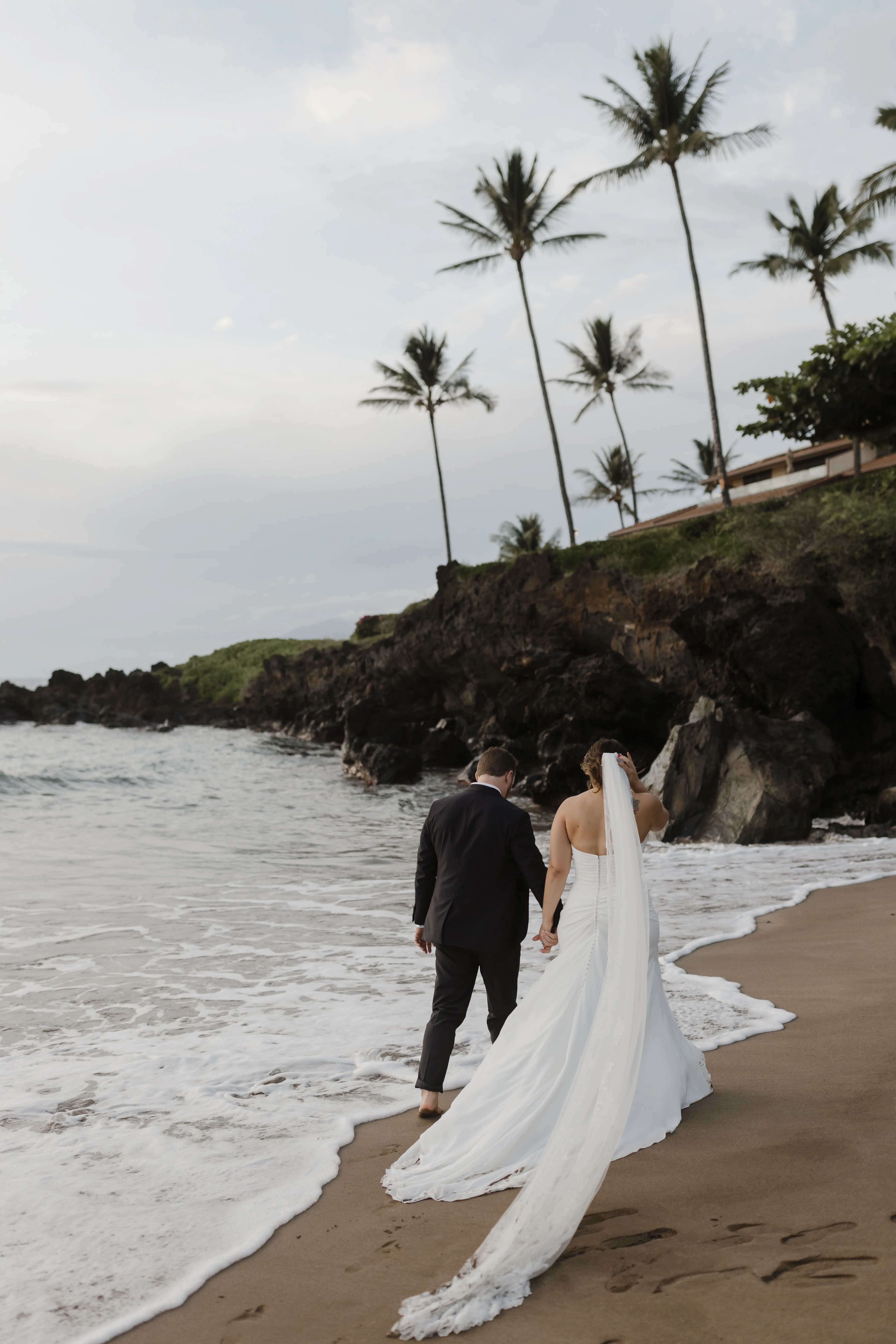 Bride On Beach With Groom In Strapless Wedding Dress Called Monaco By Maggie Sottero