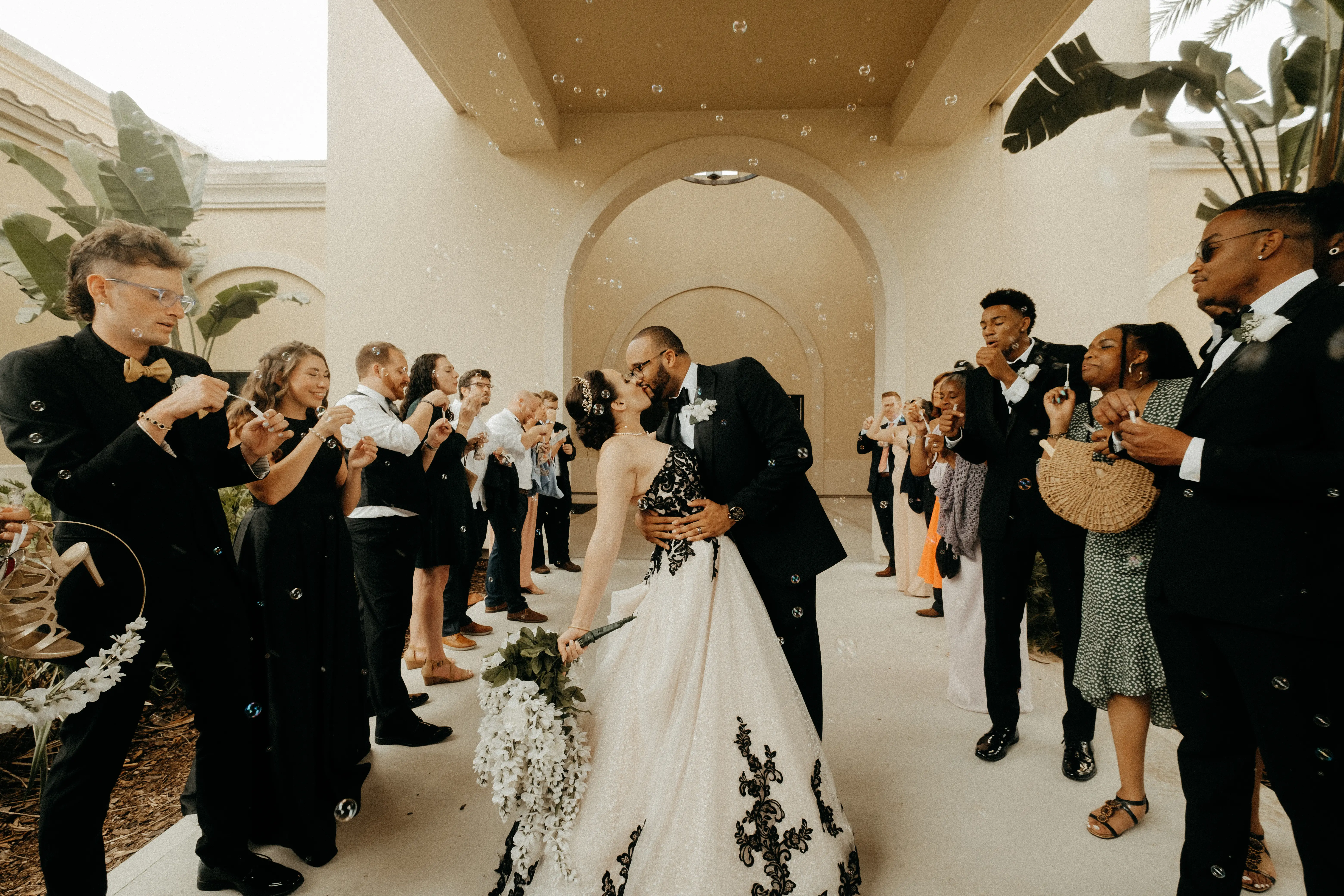 Bride wearing Tristyn wedding dress by Maggie Sottero kissing her husband