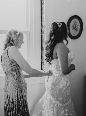 Mother of Bride Zipping Wedding Dress on Bride Called Hattie by Rebecca Ingram