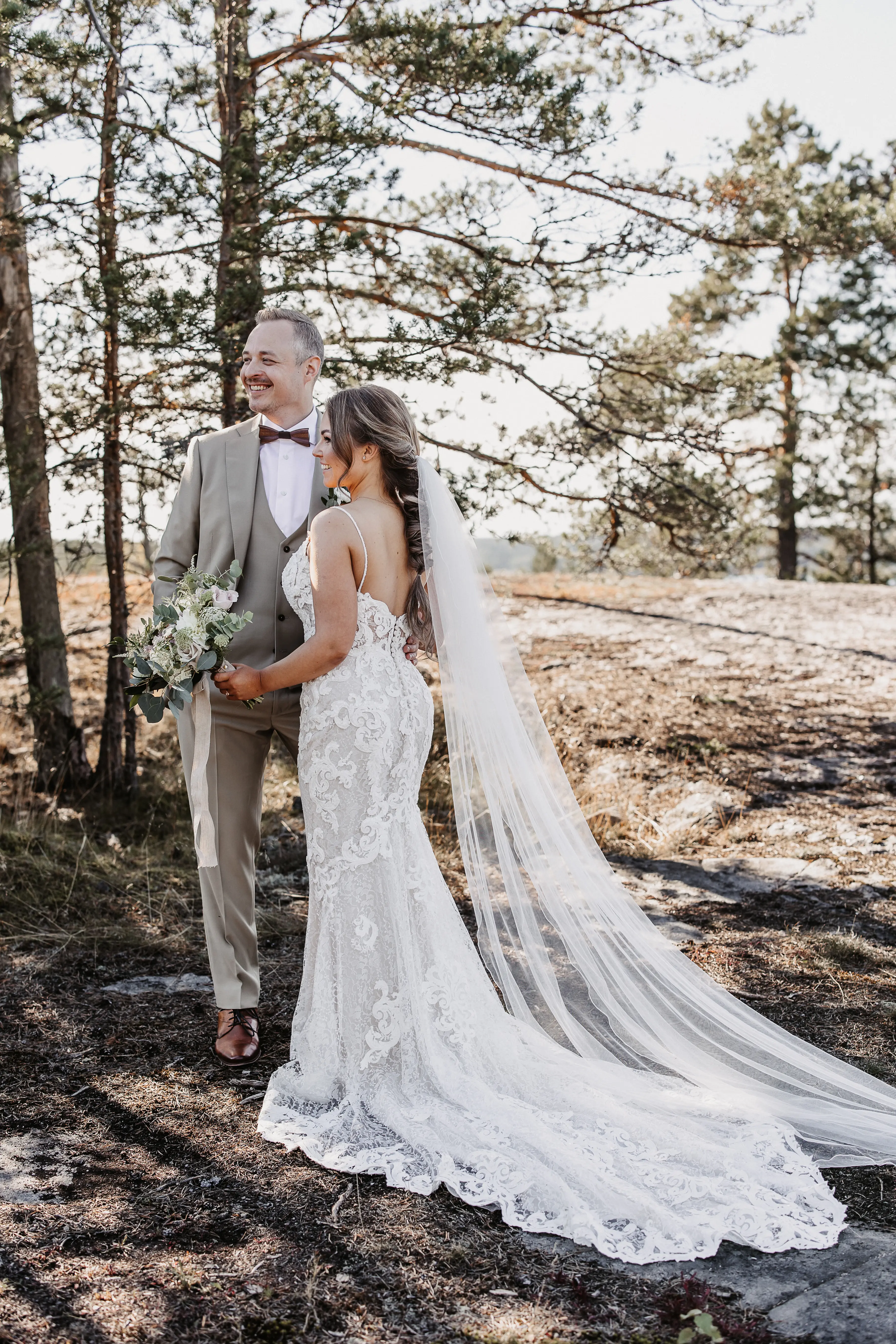 Bride Wearing Sexy Lace Wedding Dress Called Tuscany Lynette By Maggie Sottero With Groom In A Forest