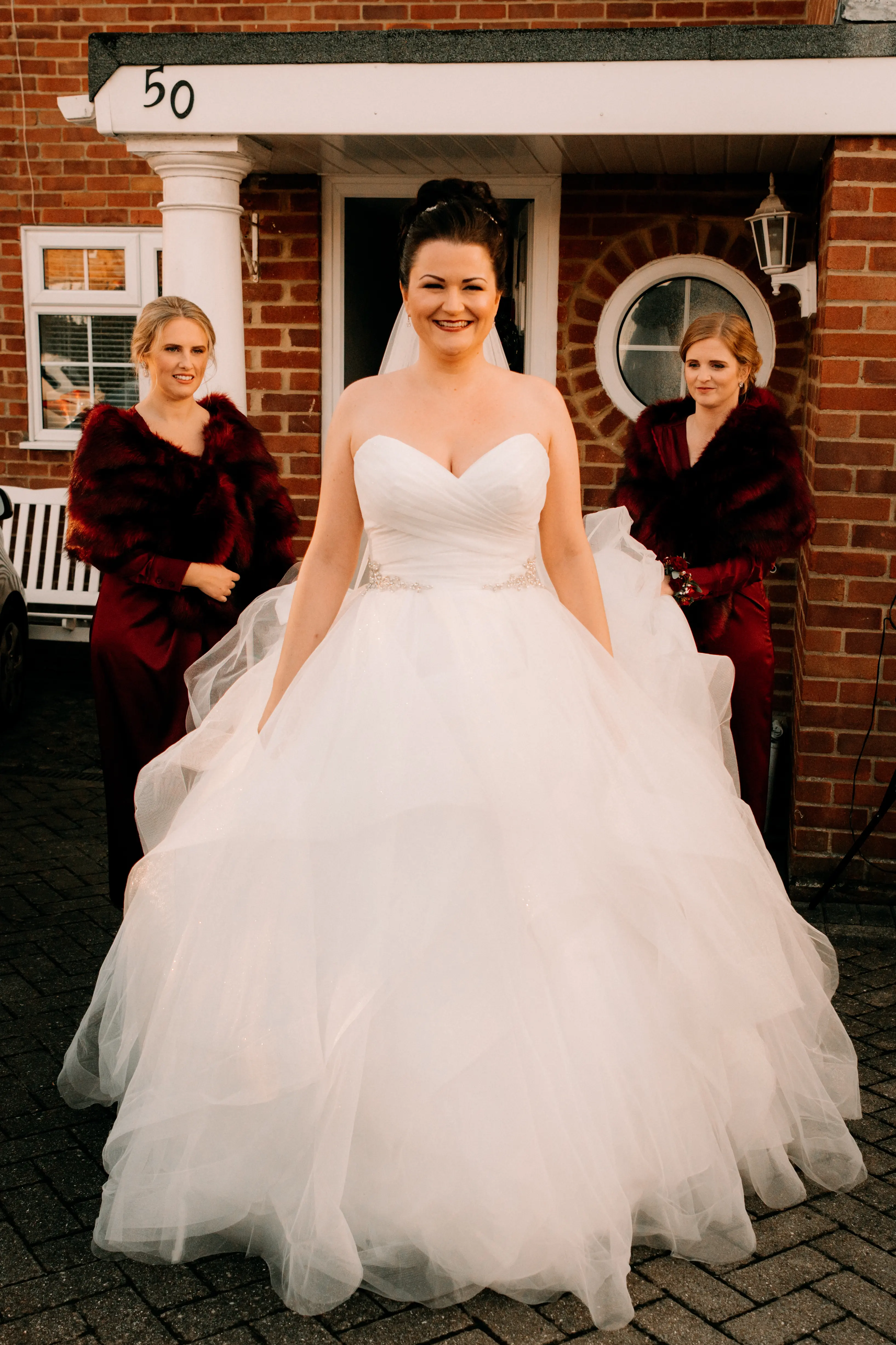 Bride In Tiered Ballgown Yasmin Maggie Sottero With Bridesmaids in Red