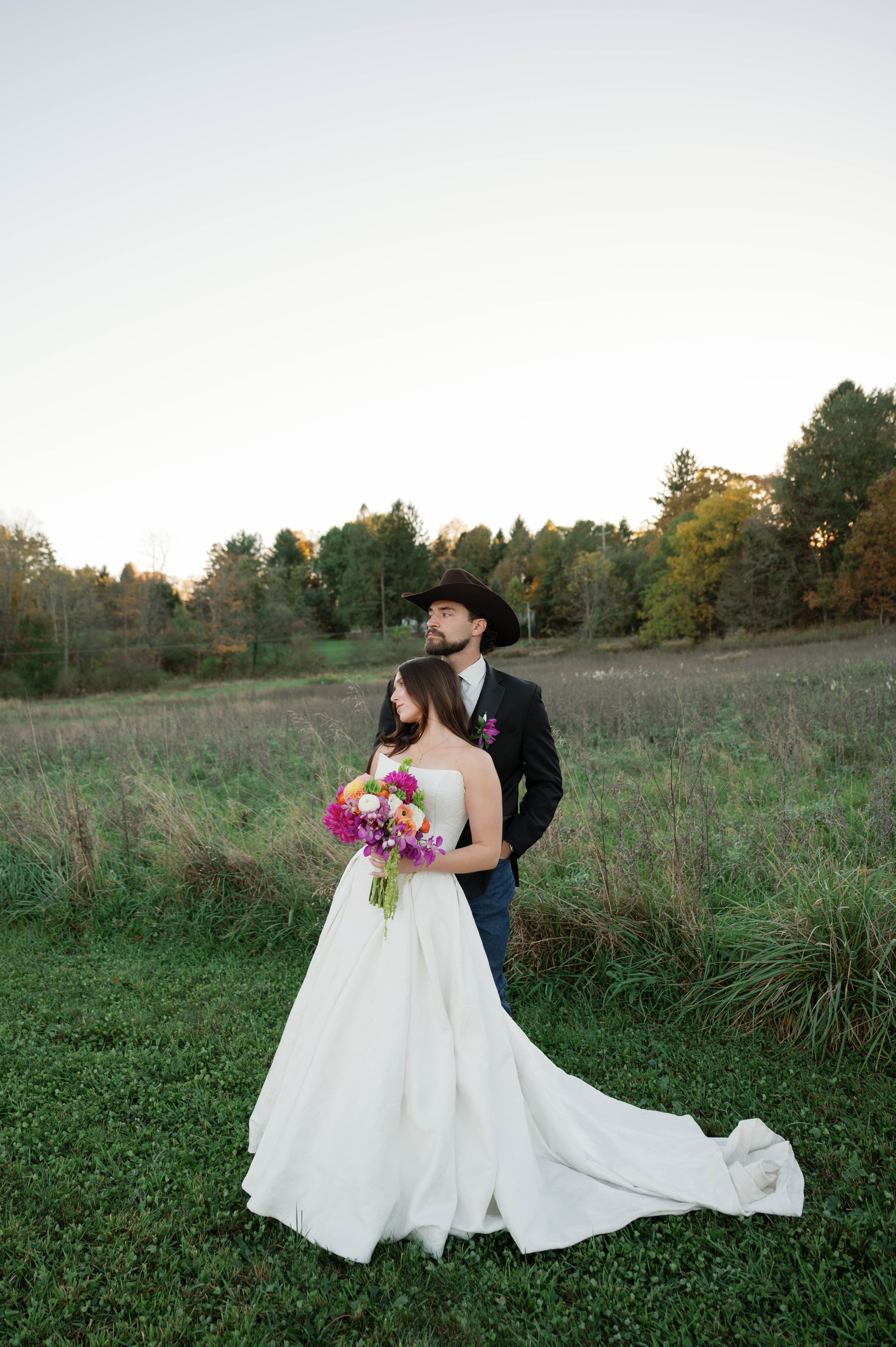 Bride Wearing Jacquard Ballgown Wedding Dress Called Fortune Marie By Maggie Sottero With Groom in a cowboy hat