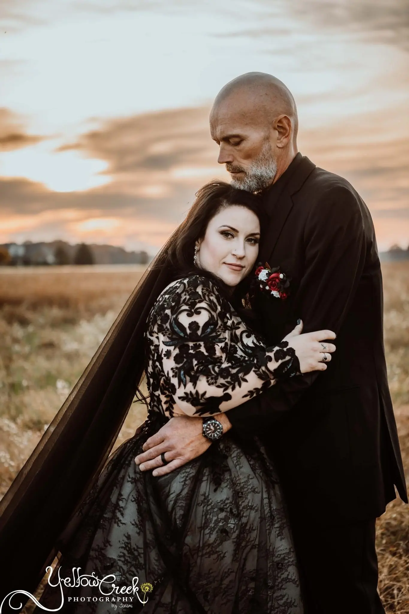 Bride and Groom Standing Together. Bride Wearing Dramatic Black Lace Ballgown Called Zander By Sottero And Midgley