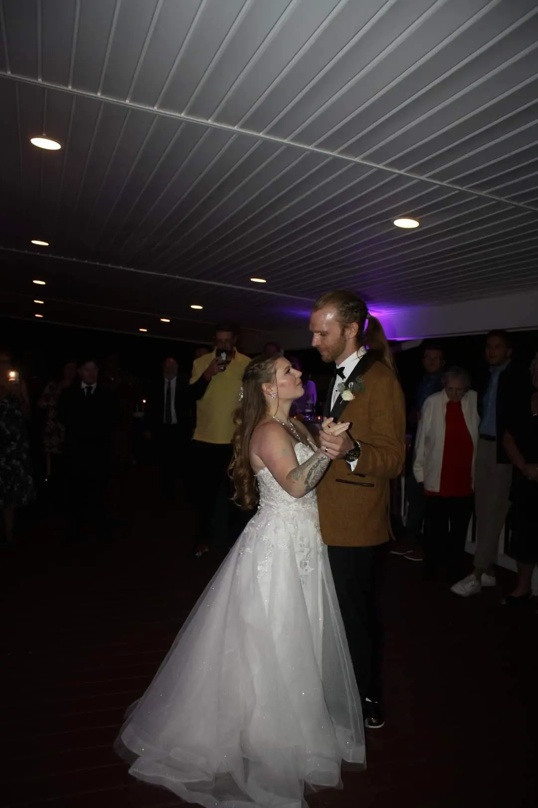 Bride Wearing Princess Wedding Dress With Long Sleeves Called Stevie By Maggie Sottero Dancing With Groom At Reception