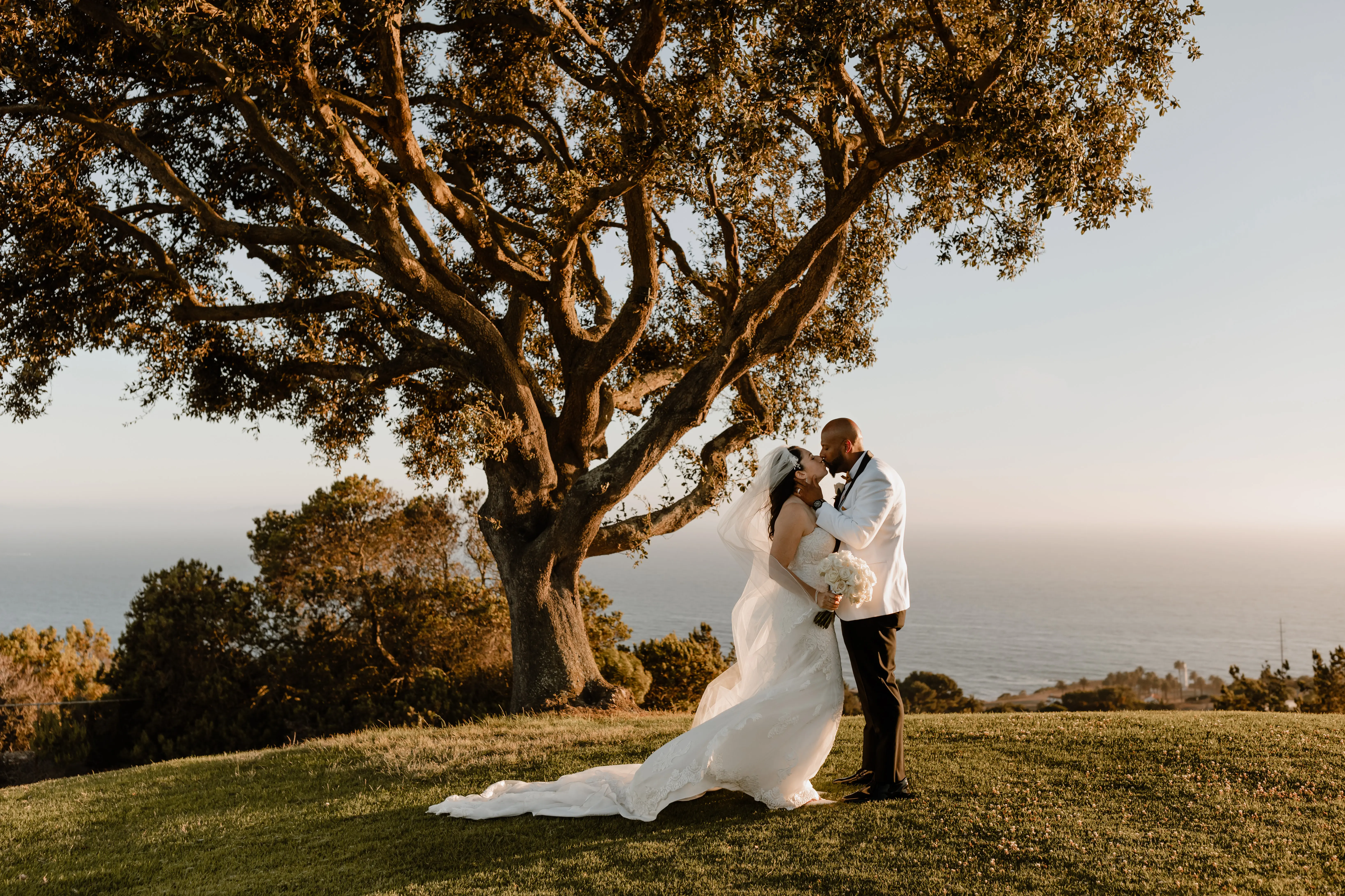 Bride Wearing Lace Wedding Dress Called Fiona By Maggie Sottero At Tropical Venue With Groom In White Suit