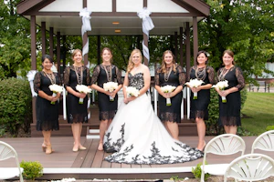 Bride Wearing A-Line Black Lace Wedding Dress Called Tristyn By Maggie Sottero With Her Bridesmaids